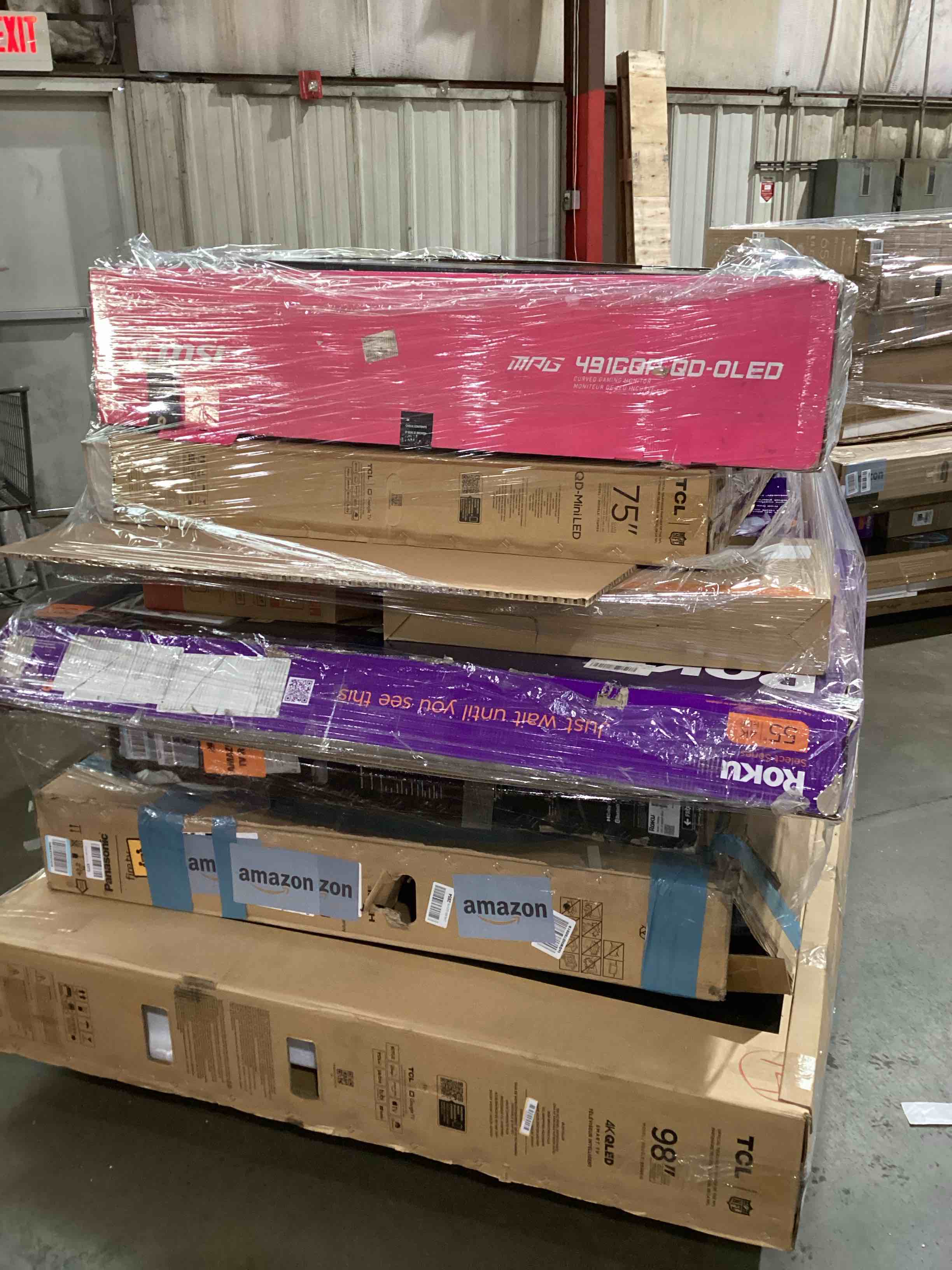 Condition photo showing As Is for pallet of broken TVs and monitors 