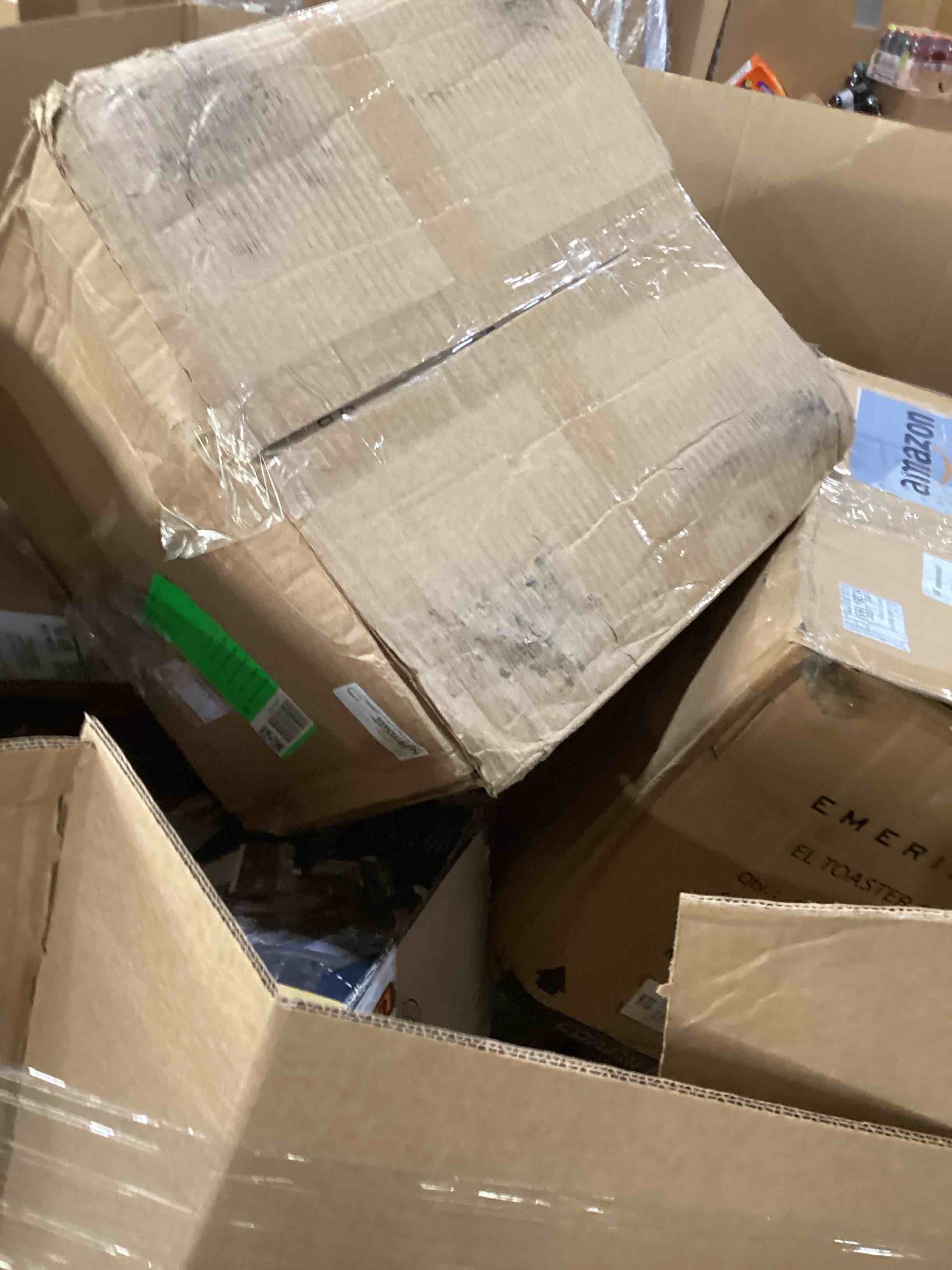 Condition photo showing As Is for pallet of damaged miscellaneous appliances and parts