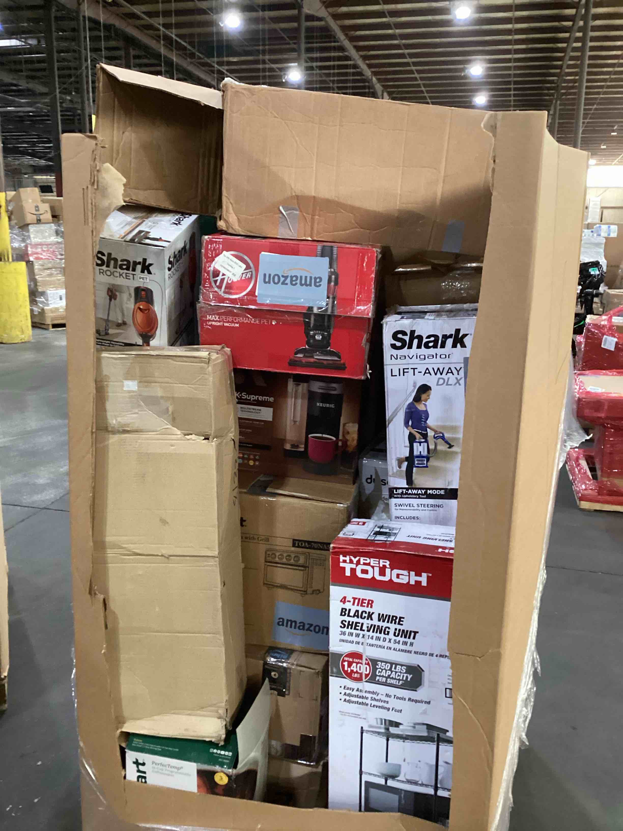 pallet of damaged miscellaneous appliances and parts