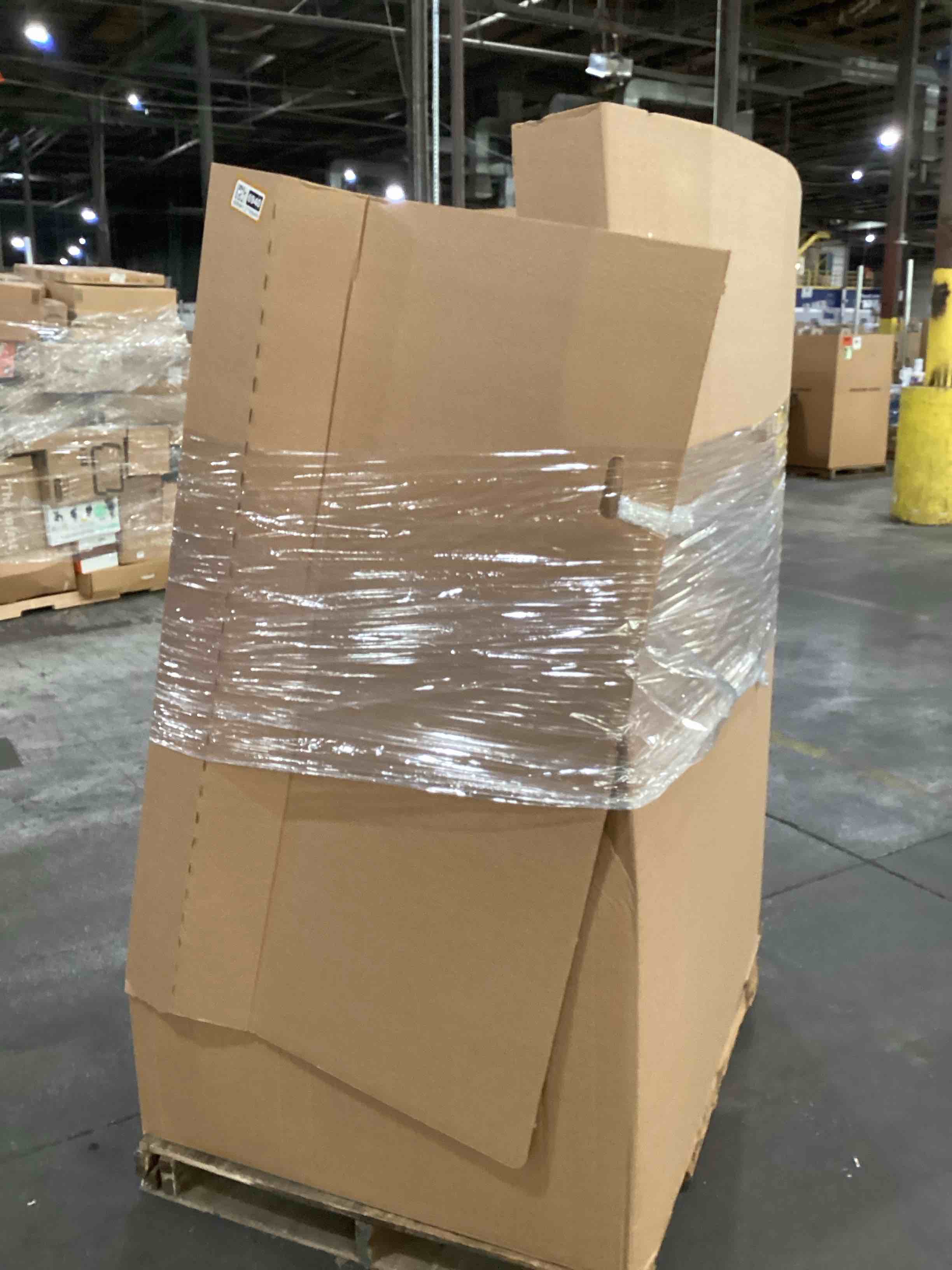 Condition photo showing As Is for pallet of damaged miscellaneous appliances and parts