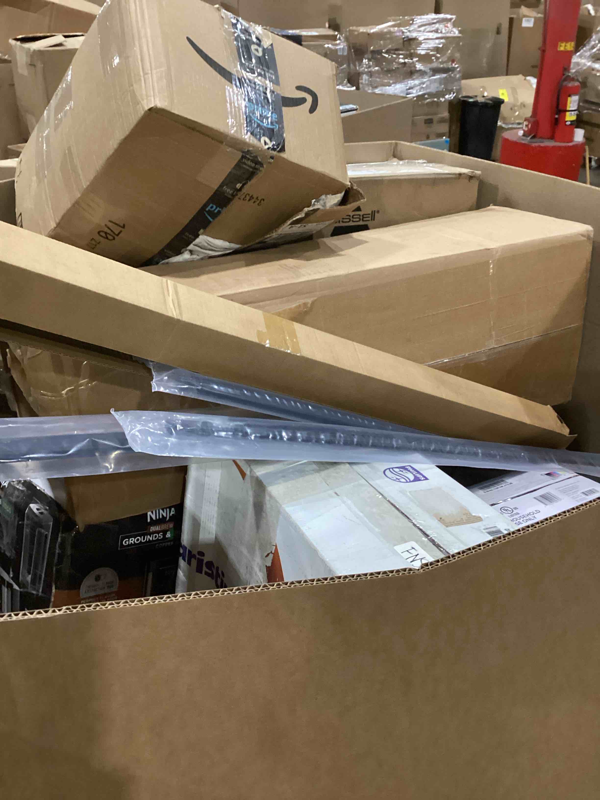 Condition photo showing As Is for pallet of damaged miscellaneous appliances and parts 