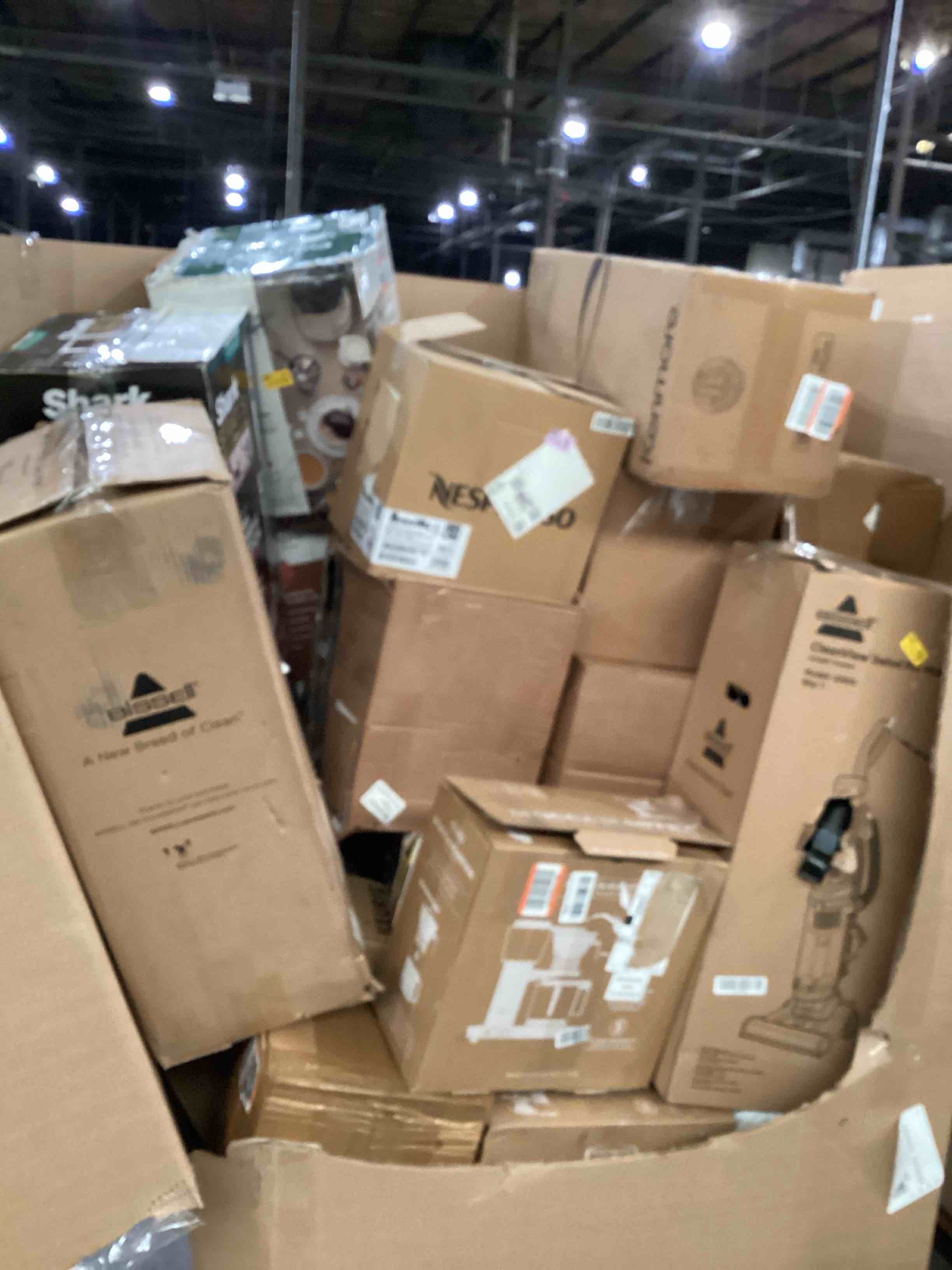 pallet of damaged miscellaneous appliances and parts 