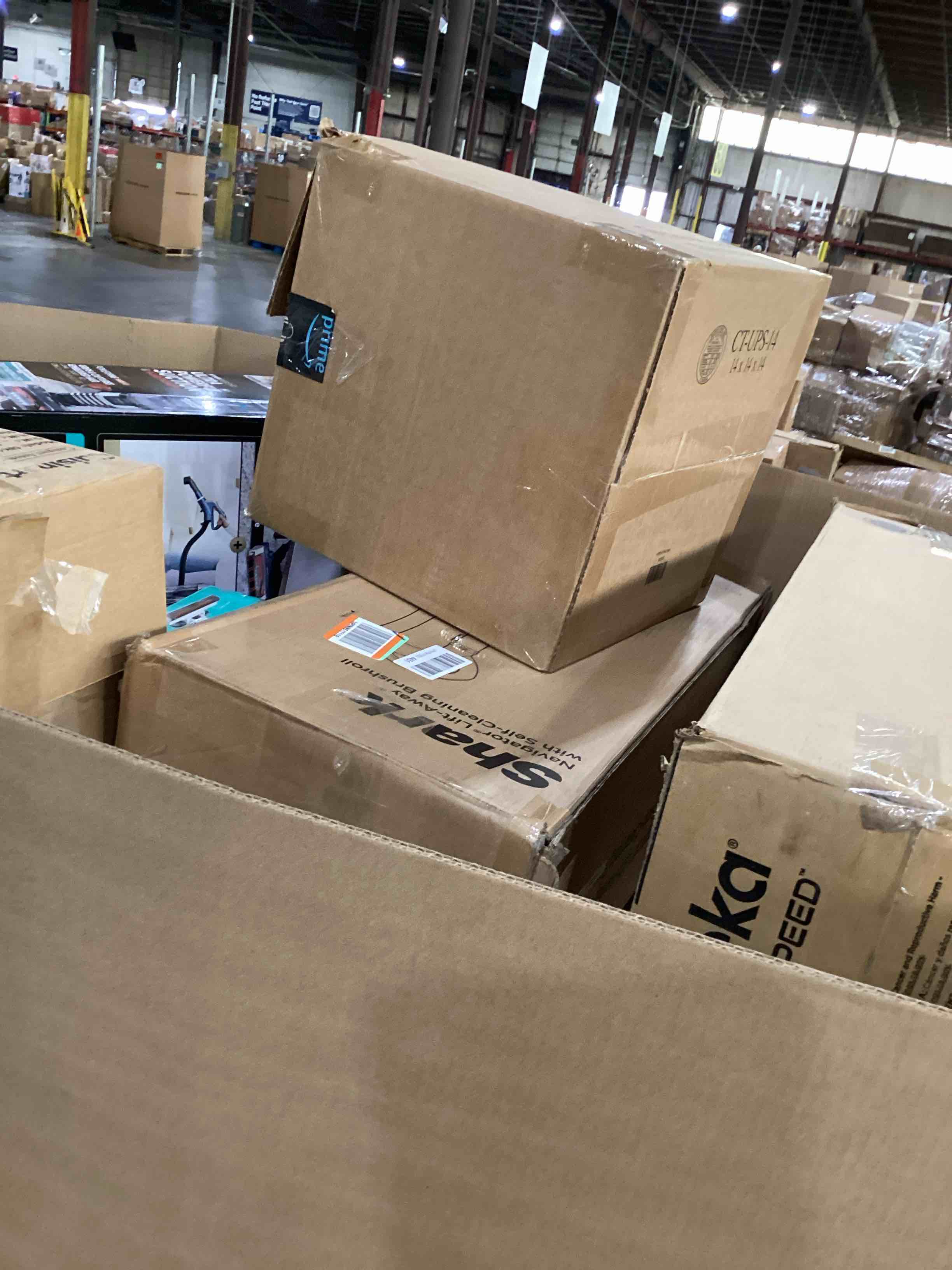 Condition photo showing As Is for pallet of damaged miscellaneous appliances and parts 