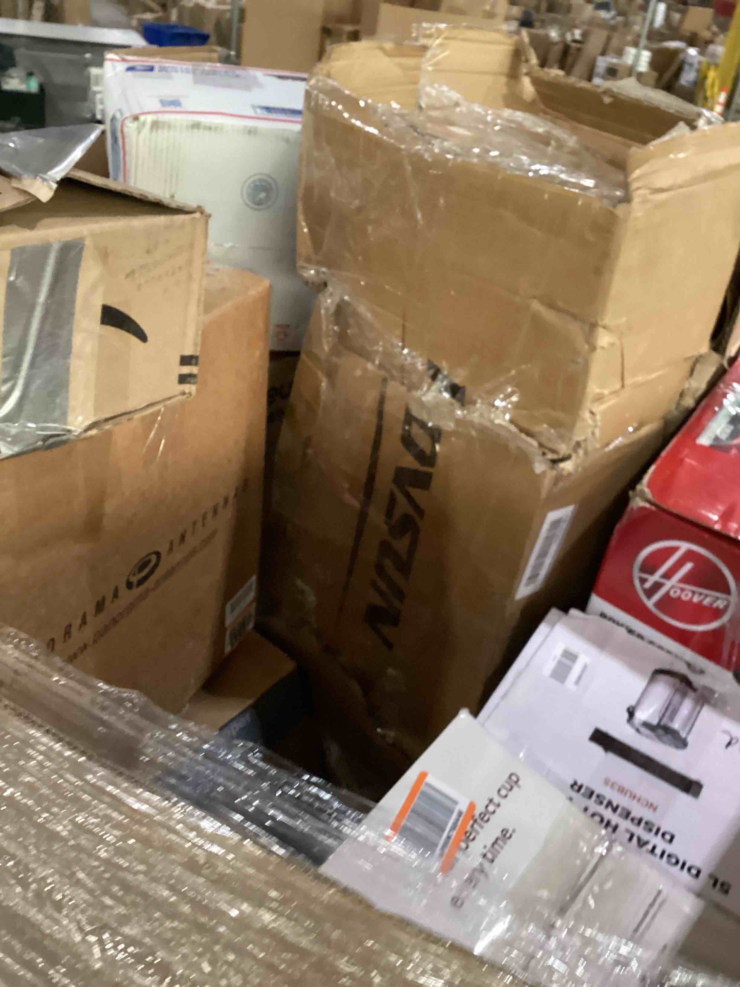 Condition photo showing As Is for pallet of damaged miscellaneous appliances and parts 