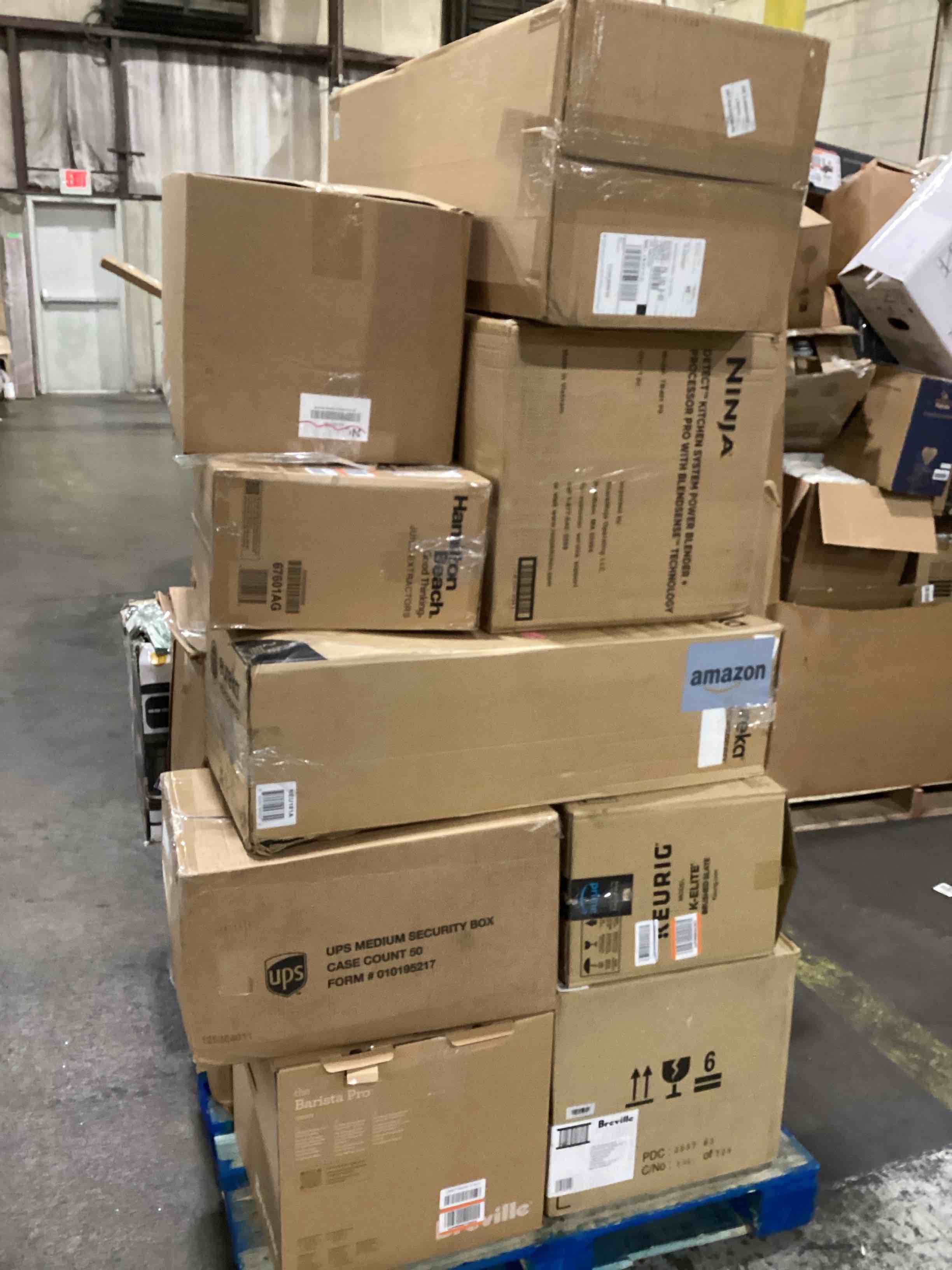 Condition photo showing As Is for pallet of miscellaneous appliances damaged or missing parts