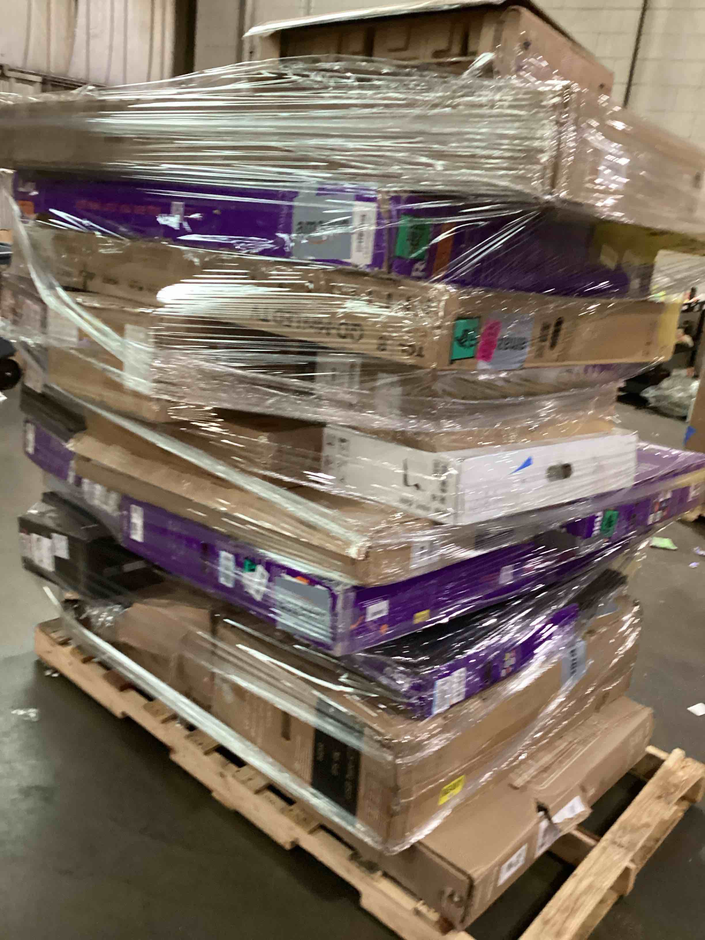 Condition photo showing As Is for pallet of broken tvs and monitors