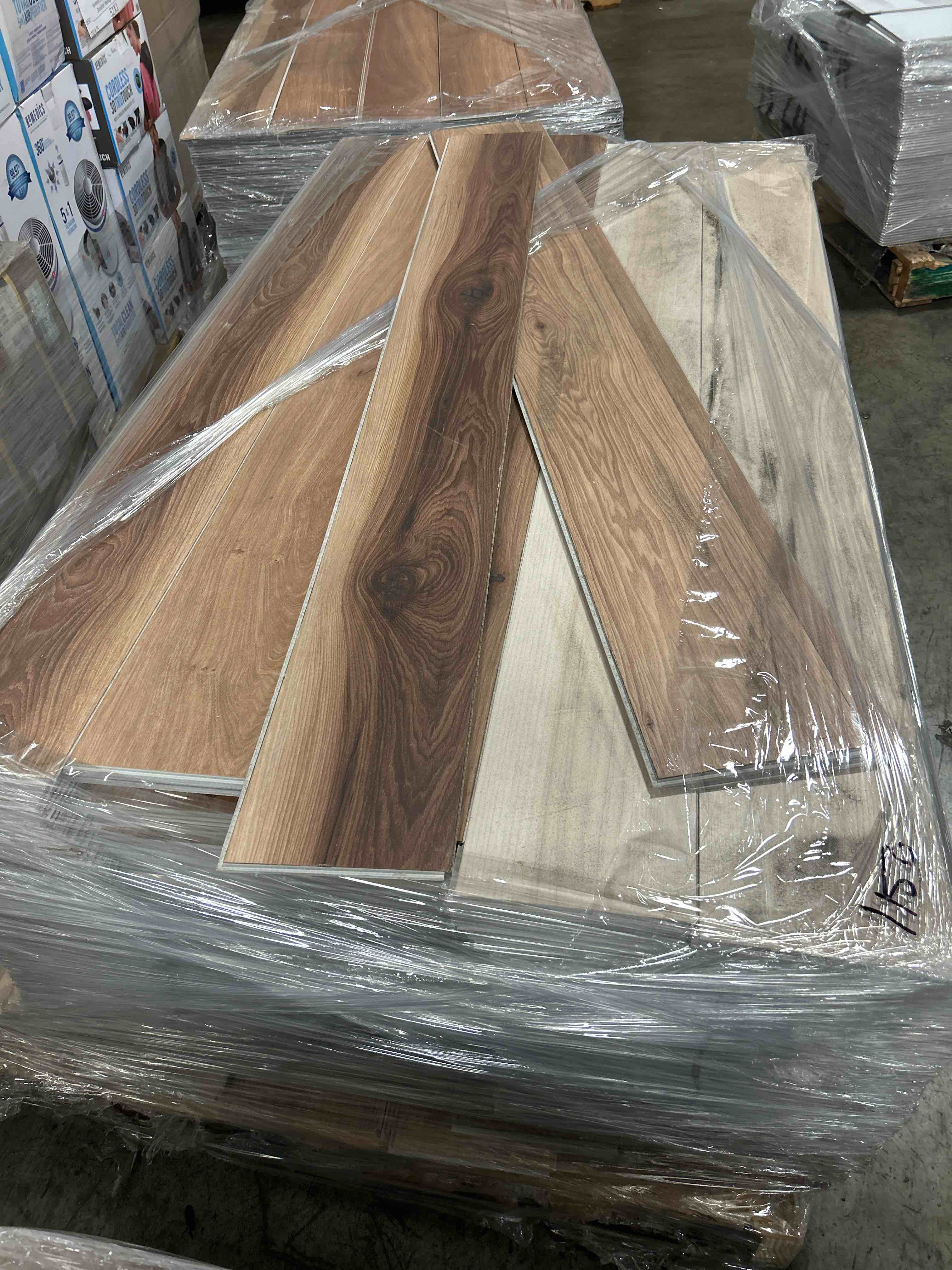 LVP Flooring with Attached Pad Mixed Planks 6.5” x 60”  Approx 1150 sq ft - bid per sq ft 