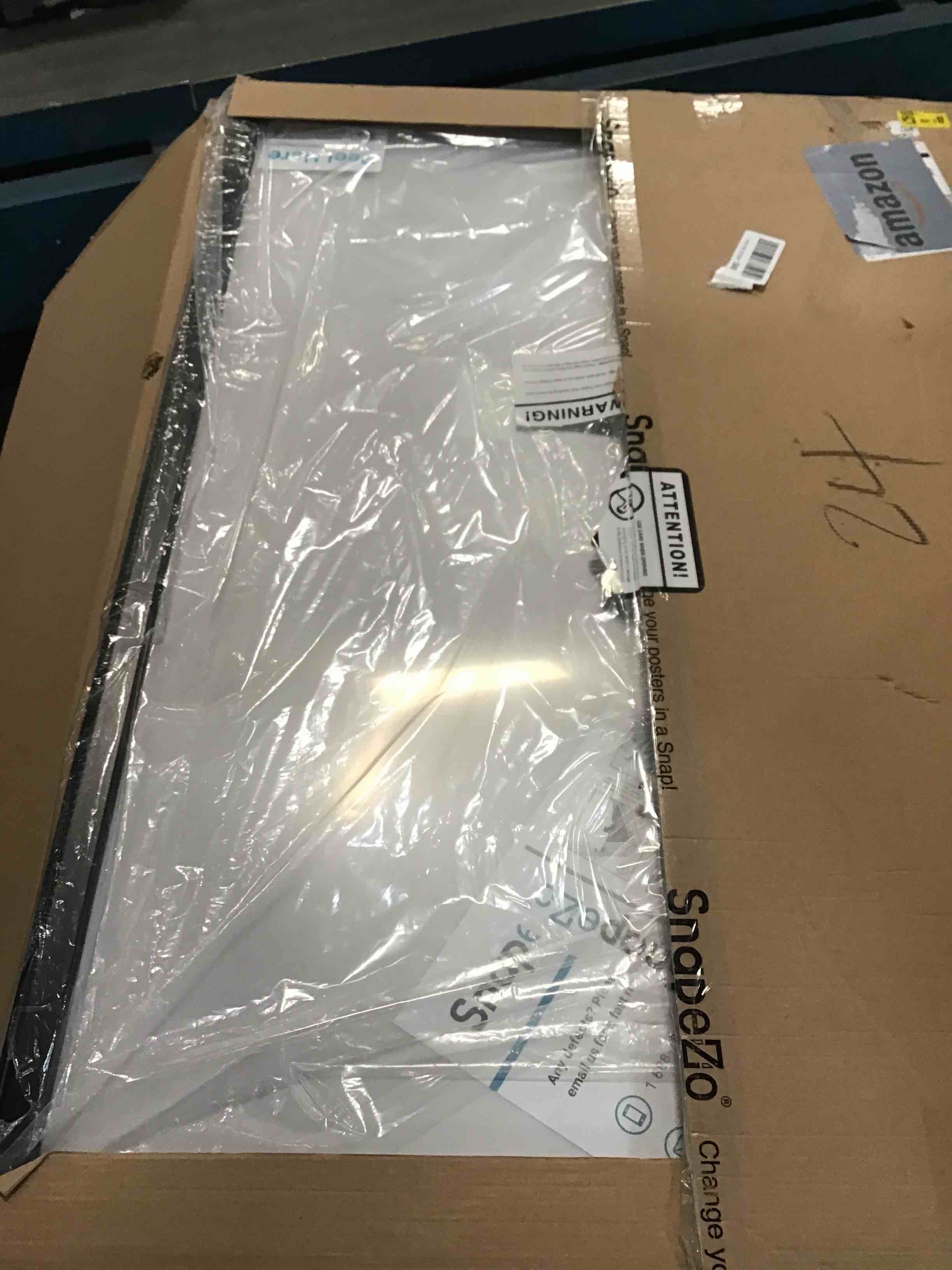 Condition photo showing Good Condition for SnapeZo 27x40 Movie Poster Frame, Black, 1.25 Inch Aluminum Profile, Front-Loading Snap Frame, Wall Mounting, Professional Series for One Sheet Movie Posters 27x40 Black