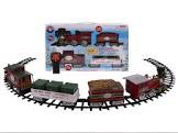 North Pole Central Ready To Play Large Gauge Set Battery-powered locomotive with authentic train sounds and announcements, including bell and whistle; Working headlight; Fixed knuckle couplers, removable crate load in the gondola; User-friendly remote.