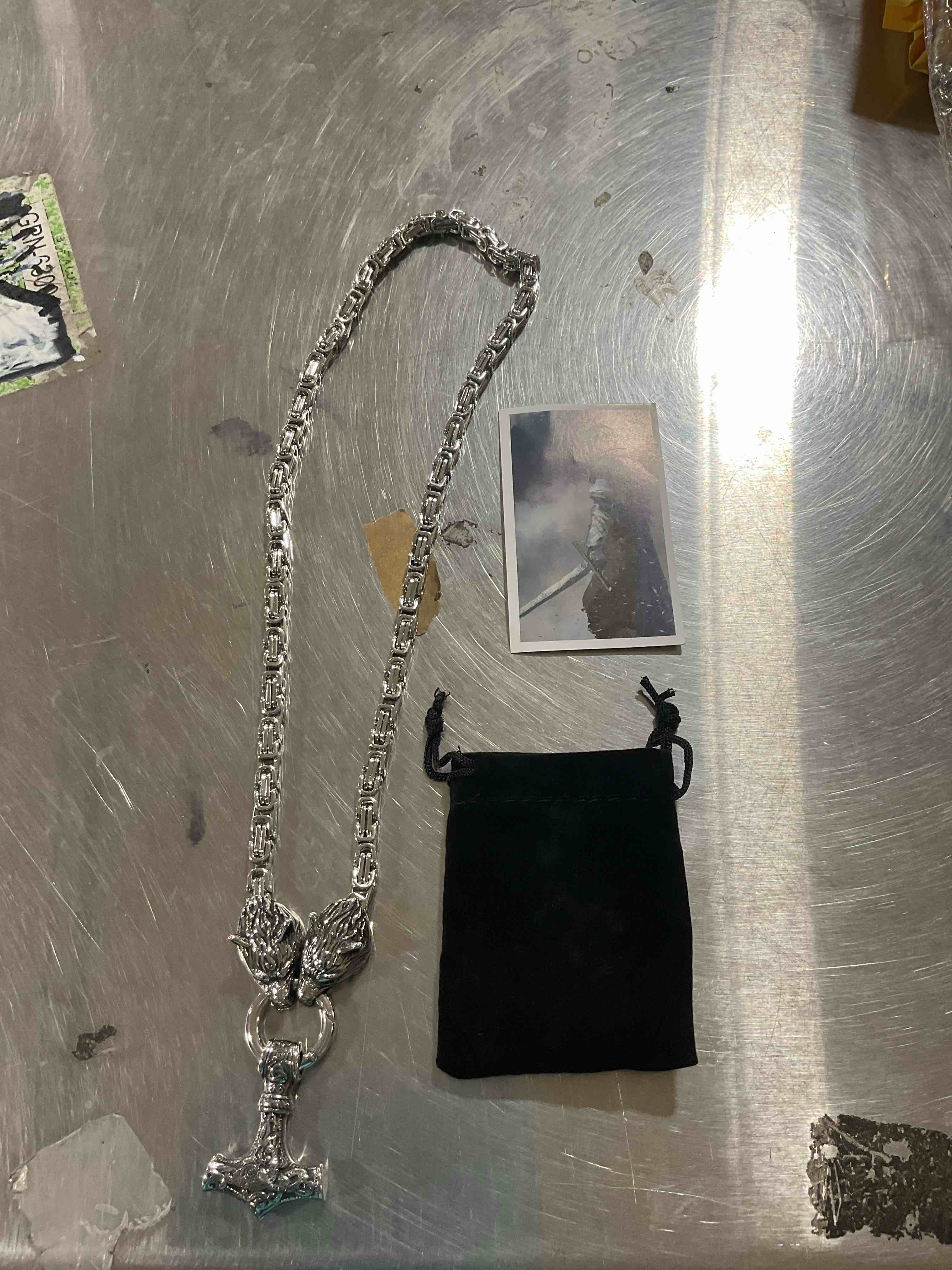 Silver necklace with satin bag