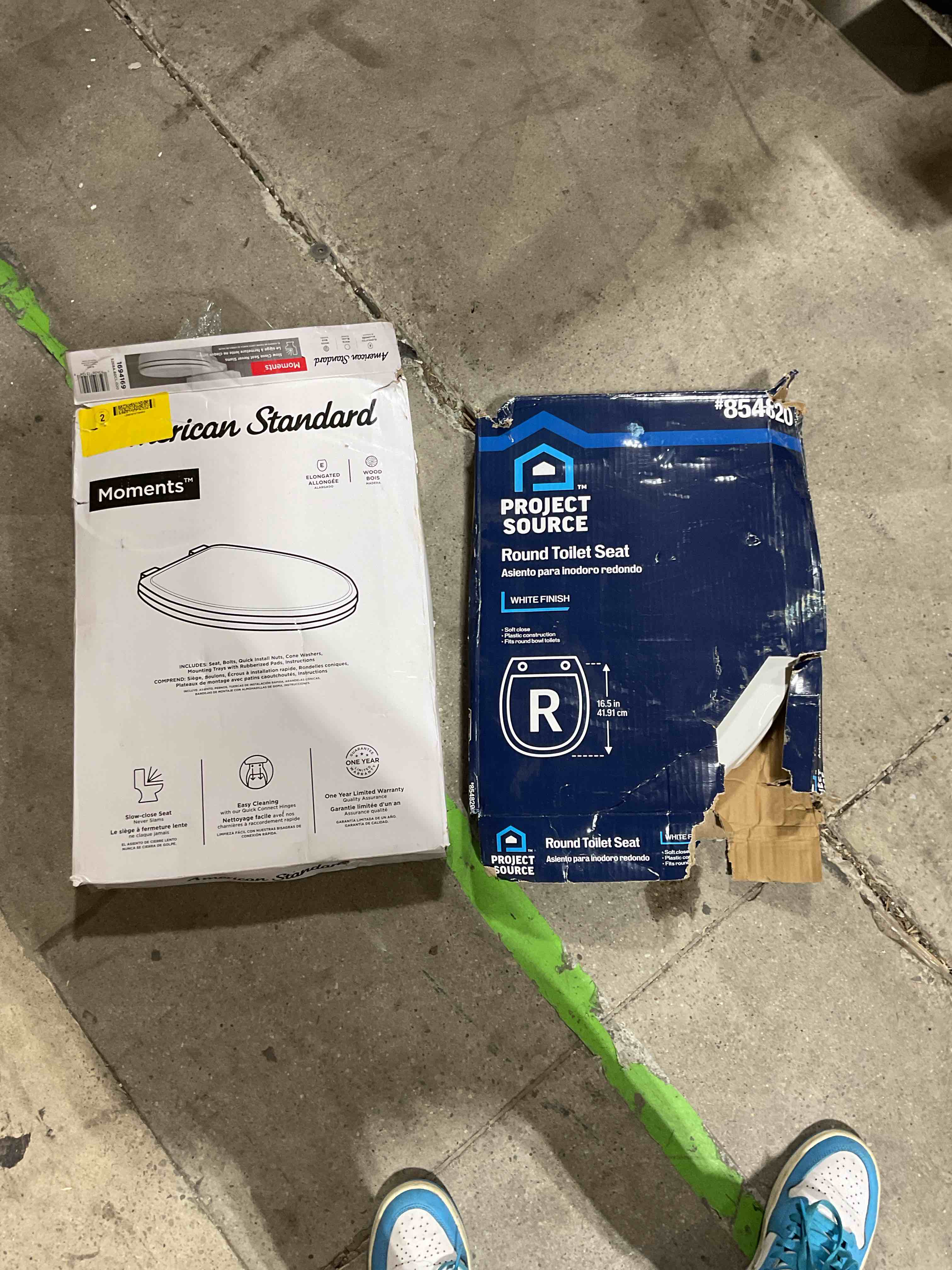 two toilets both white different sizes