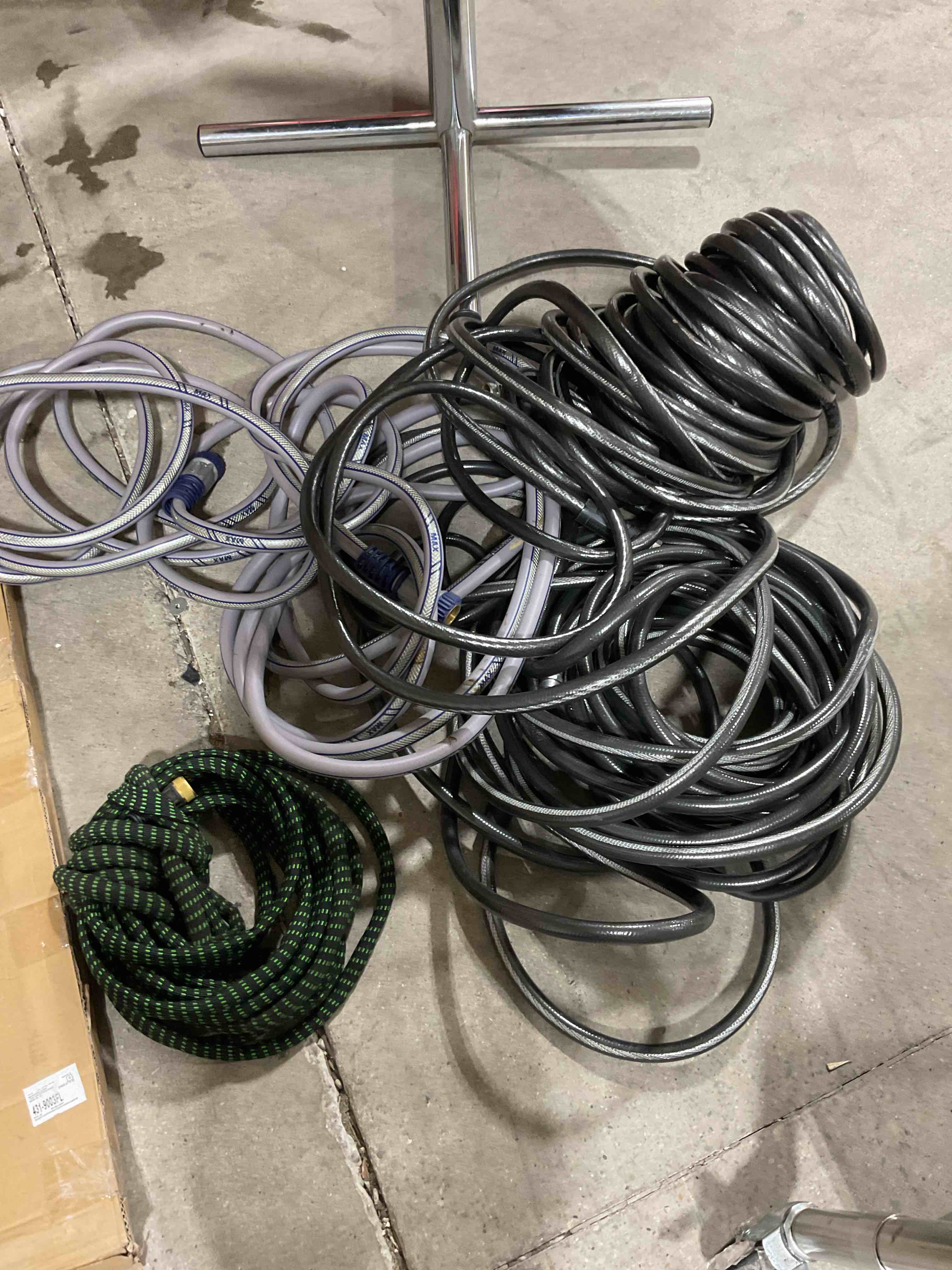 4 assorted garden hoses length unknown