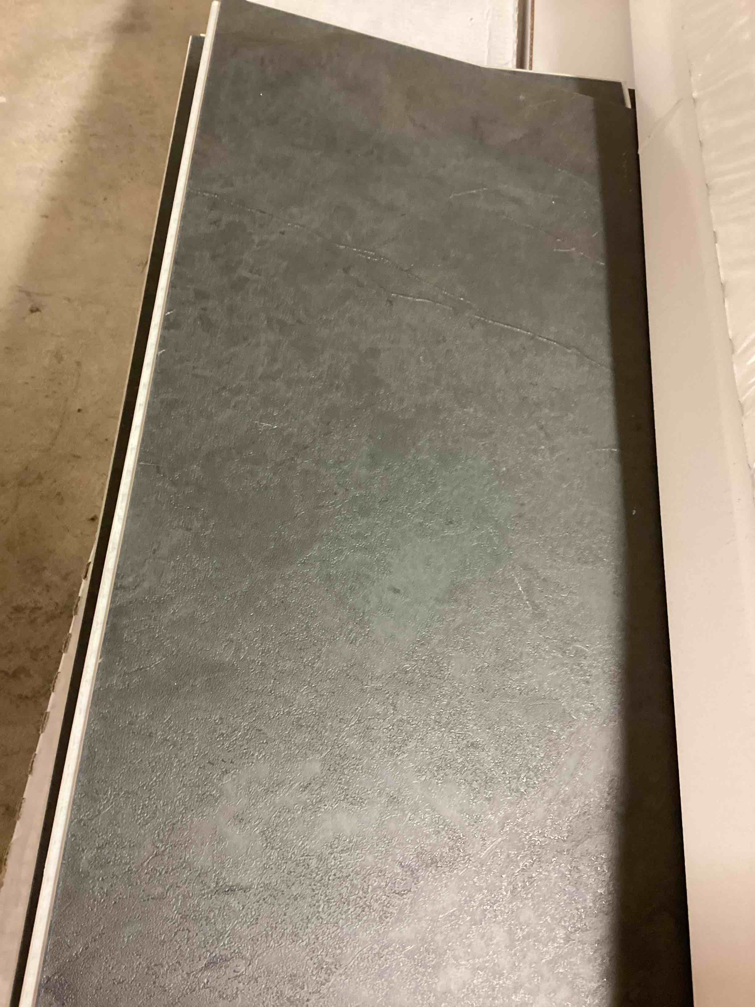 39 boxes of assorted flooring, vinyl and laminate, different colors and sizes. 39 boxes to pick up. Bid per box 