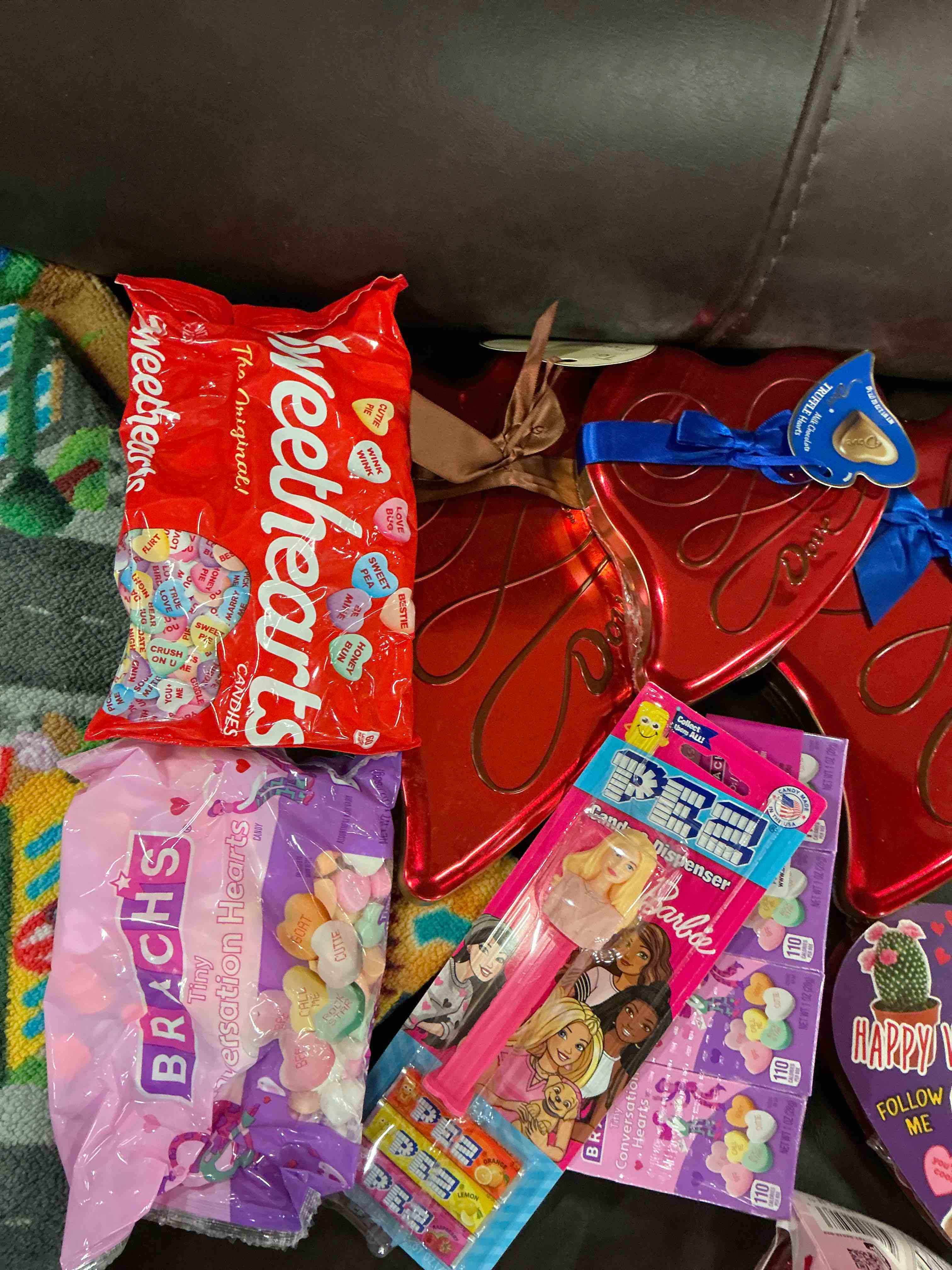 Assortment of sweets of different flavors(Kisses chocolate/weethearts/Pez and more)