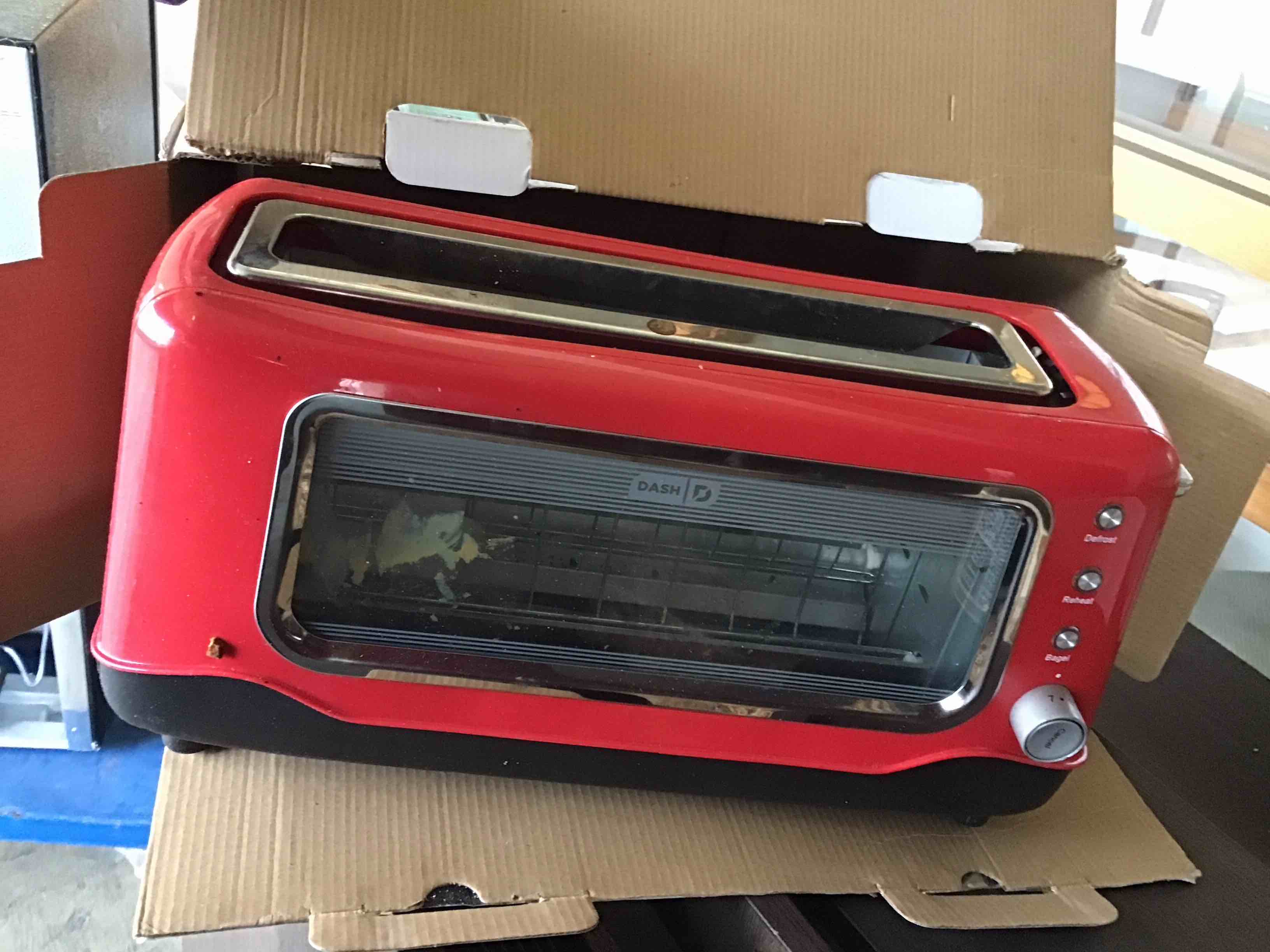 Condition photo showing As Is for Dash Clear View Toaster - Features Large Window & Extra-Wide Slots - Auto-Shut Off Feature - Bagel Functions, & Seven-Browning Levels - 1-Touch Defrost - Red