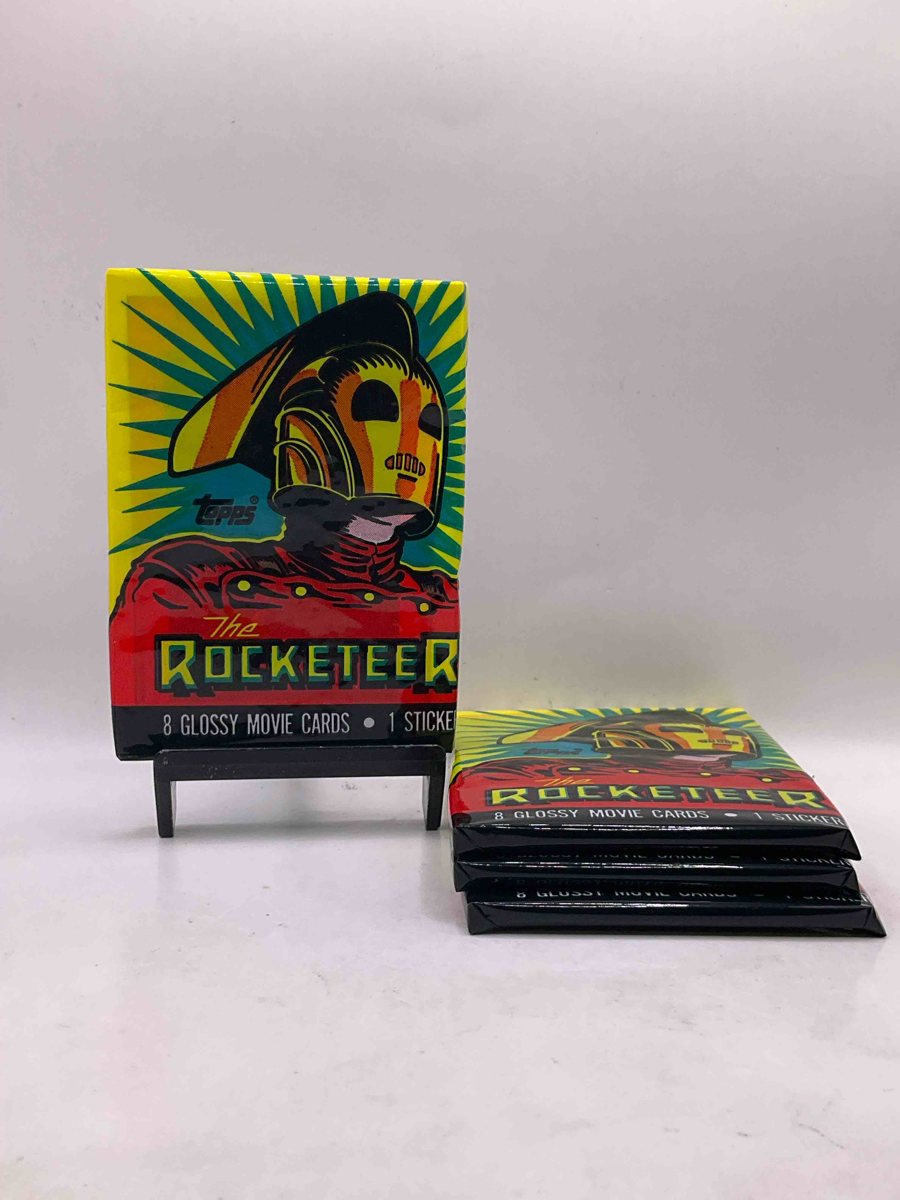 1991 Movie Rarity! The Rocketeer Movie Trading Cards Sealed Packs, Direct From Original Retail Case! These Cards Are Rare & Something You May Never Come Across Again! Own A Unique, Small Piece Of Movie Magic & Early 90's Nostalgia With These Classic The Rocketeer Cards!