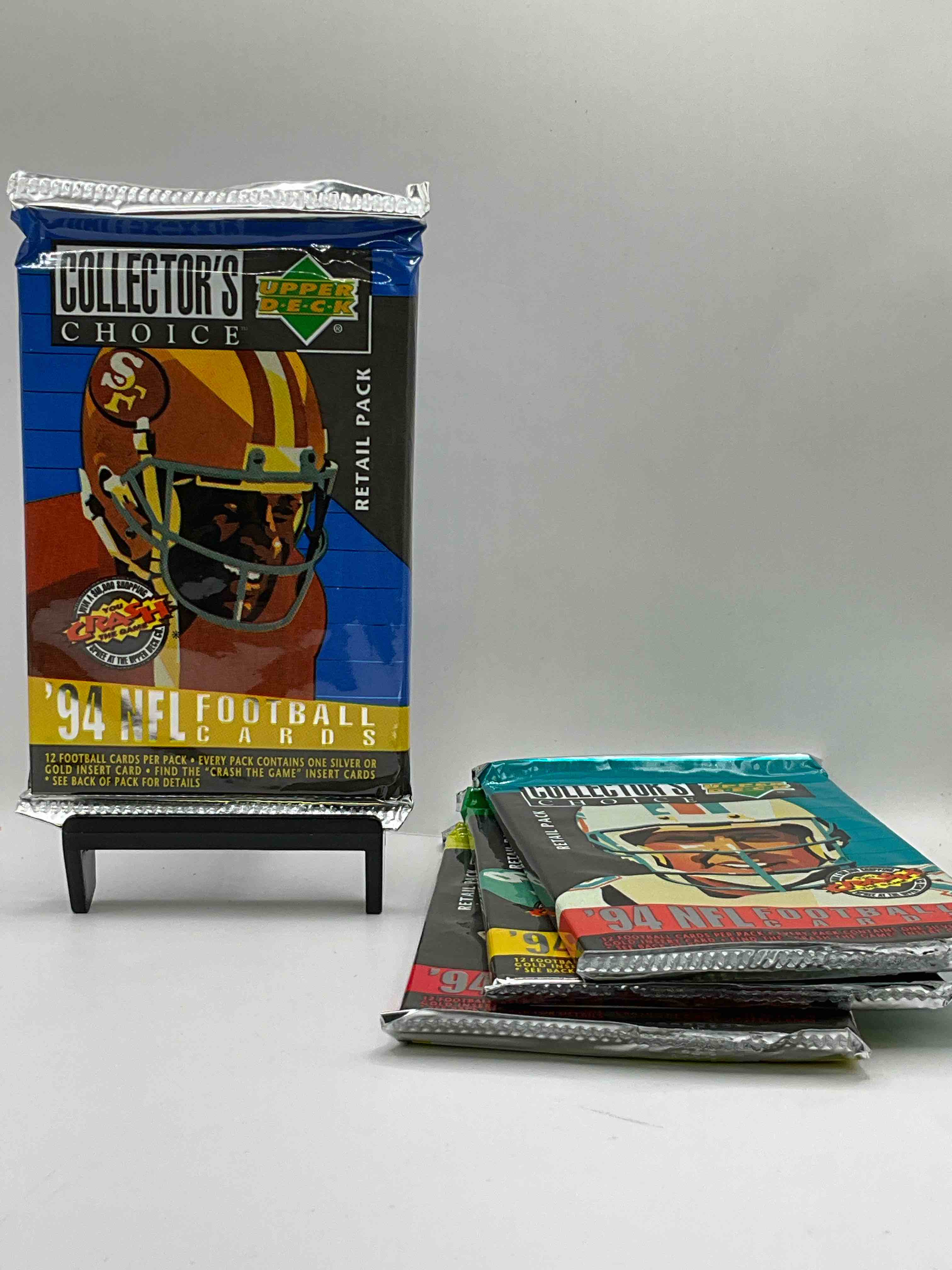 1994 Collectors Choice! Gold & Silver Card In Every Pack! Upper Deck Football Card Packs! 12 Card Football Packs, Search For The “Crash the Game” Insert Cards! Search For Big NFL Names Like Barry Sanders, Jerry Rice, Joe Montana, John Elway, Dan Marino & More! Wow!
