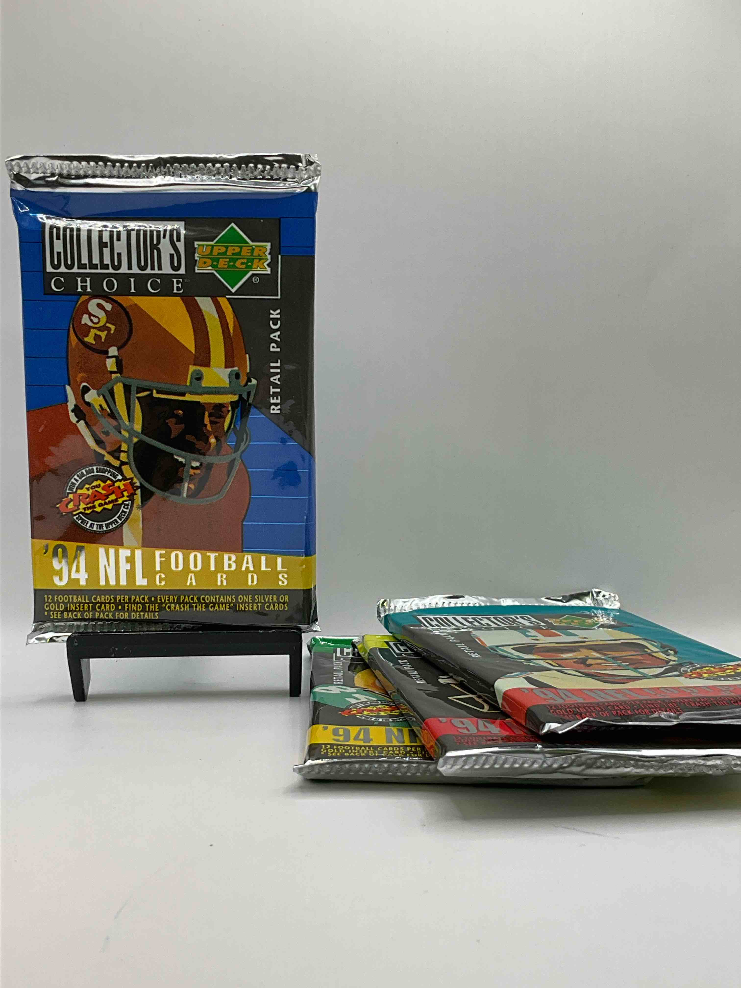 1994 Collectors Choice! Gold & Silver Card In Every Pack! Upper Deck Football Card Packs! 12 Card Football Packs, Search For The “Crash the Game” Insert Cards! Search For Big NFL Names Like Barry Sanders, Jerry Rice, Joe Montana, John Elway, Dan Marino & More! Wow!