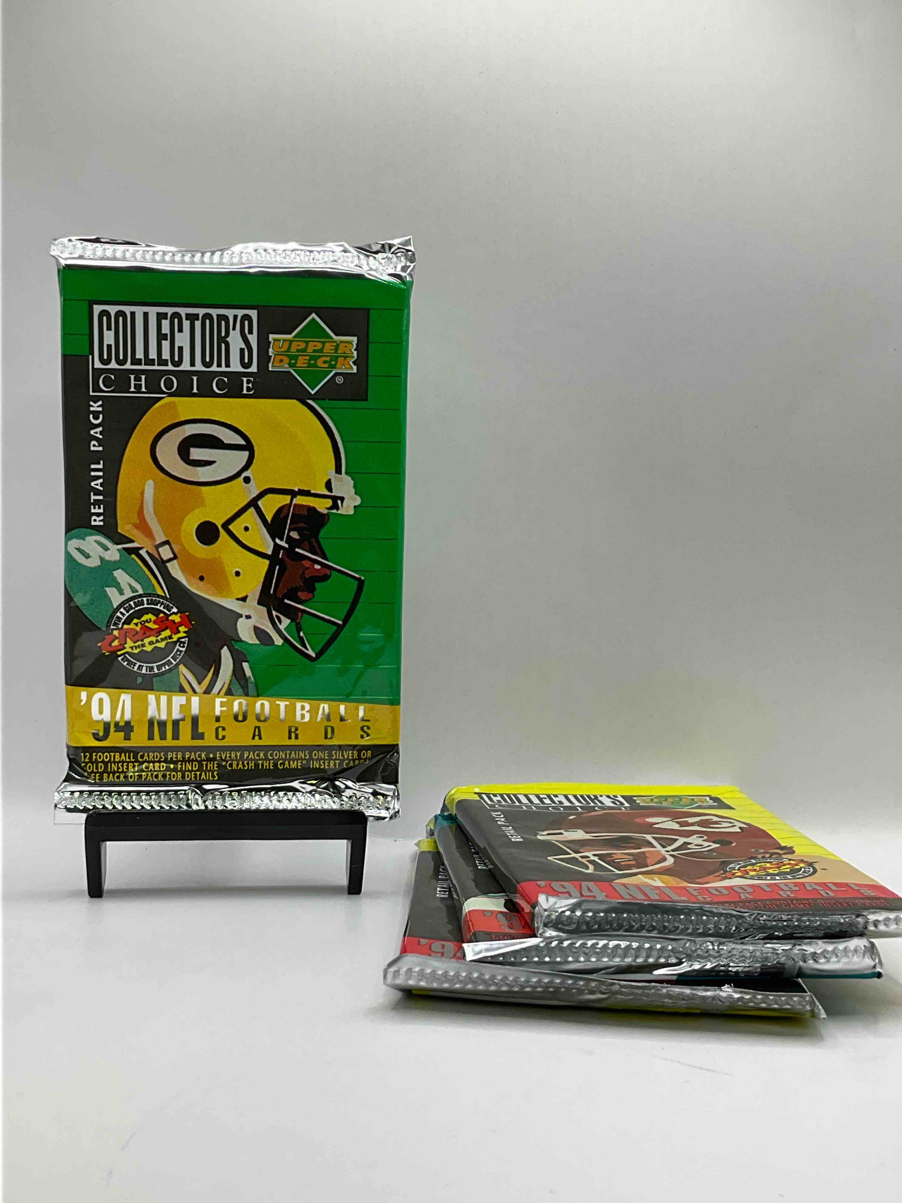 1994 collectors choice! gold & silver card in every pack! upper deck football card packs! 12 card football packs, search for the “crash the game” insert cards! search for big nfl names like barry sanders, jerry rice, joe montana, john elway, dan marino & more! wow!