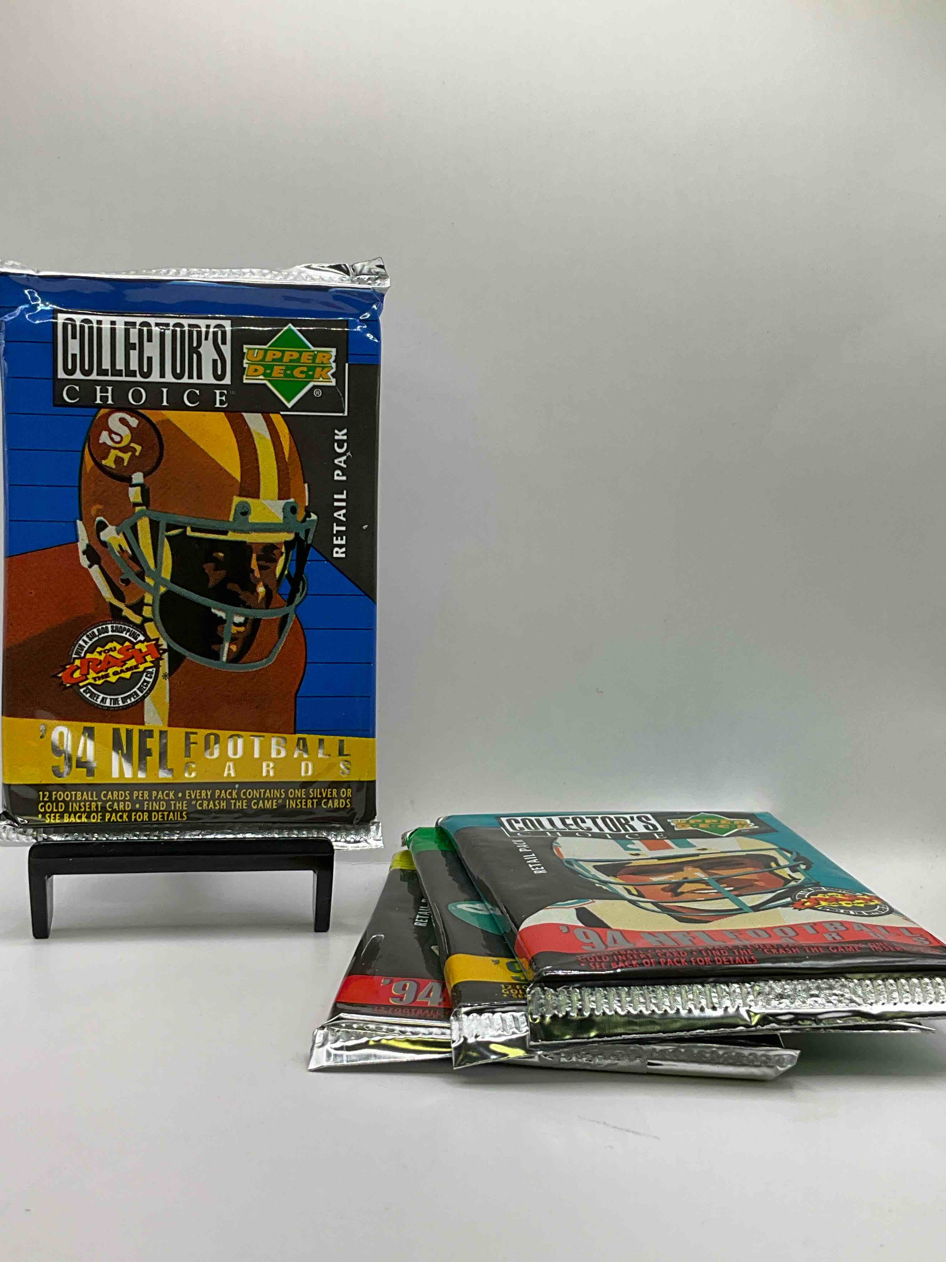 1994 Collectors Choice! Gold Or Silver Card In Every Pack! Upper Deck Football Card Packs! 12 Card Football Packs, Search For The “Crash the Game” Insert Cards! Search For Big NFL Names Like Barry Sanders, Jerry Rice, Joe Montana, John Elway, Dan Marino & More! Wow!
