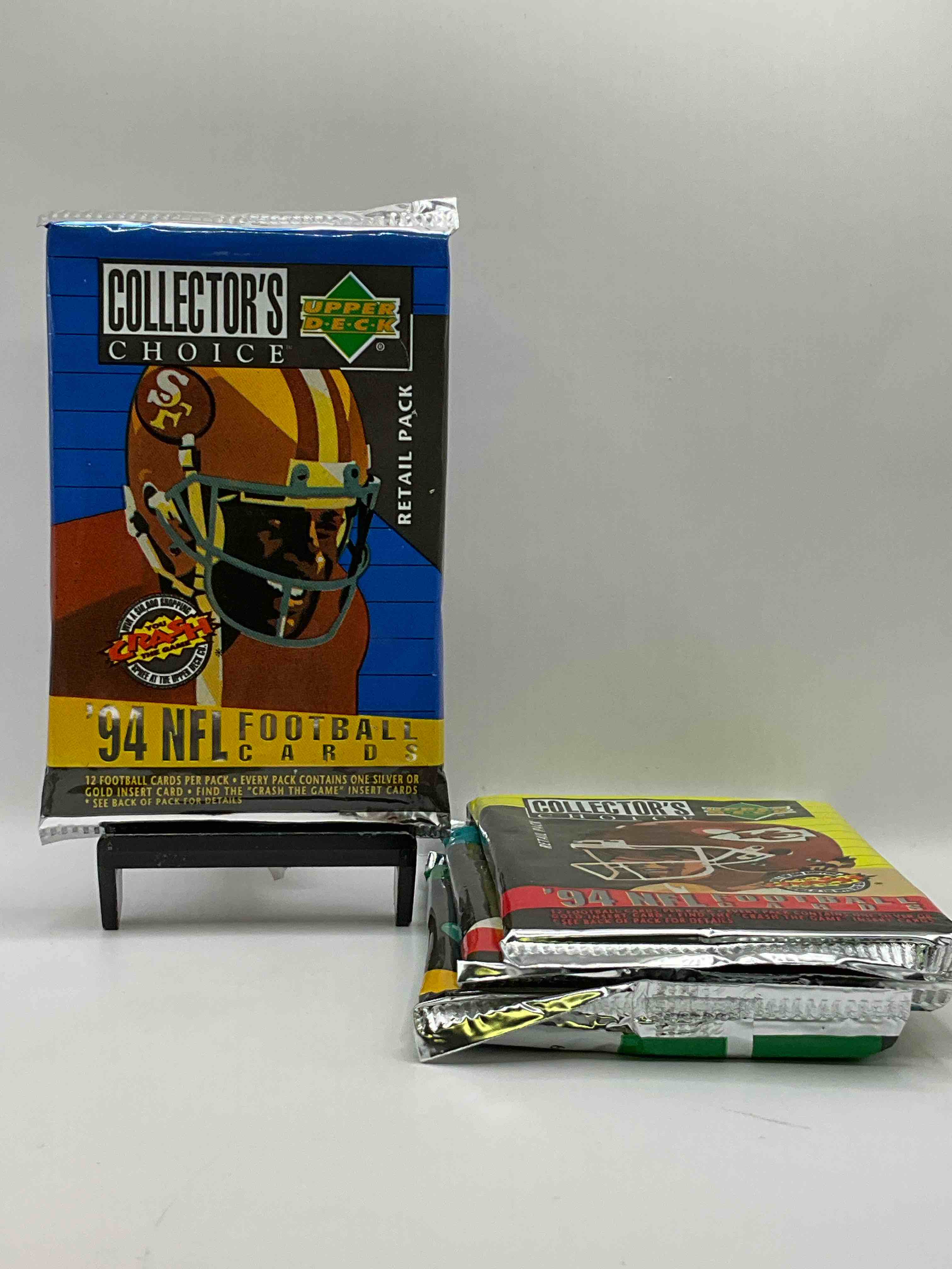 1994 Collectors Choice! Gold & Silver Card In Every Pack! Upper Deck Football Card Packs! 12 Card Football Packs, Search For The “Crash the Game” Insert Cards! Search For Big NFL Names Like Barry Sanders, Jerry Rice, Joe Montana, John Elway, Dan Marino & More! Wow!