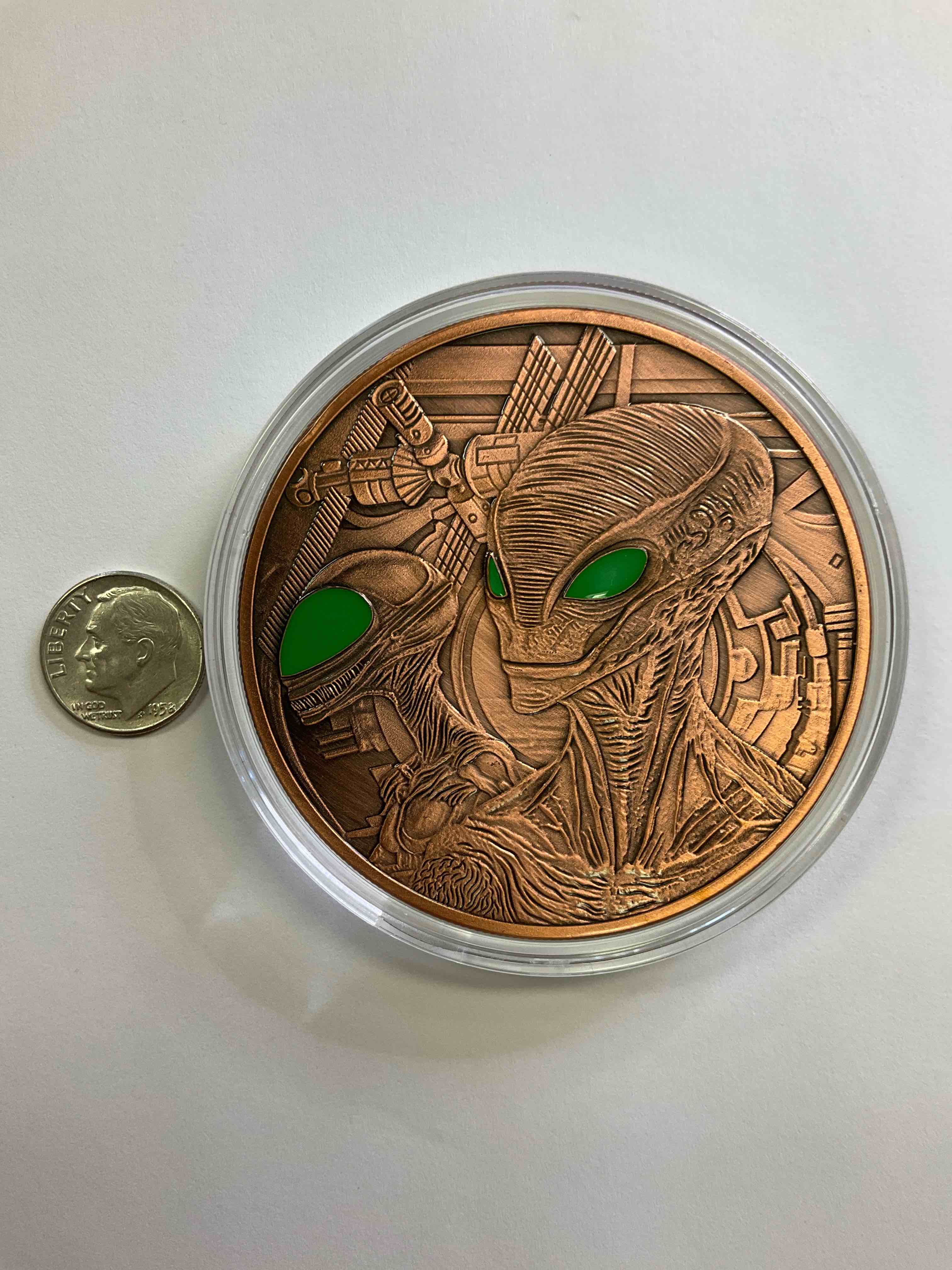 Huge Pure Copper Alien Wow! Giant 5 oz Pure Fine U.S. Copper Collector Coin! Almost 3" Diameter! Check Out This Massive 5 OZ Pure Copper Coin, With The Image Of Aliens With Colored Eyes! Makes For A Great Gift & Cool Investment In Copper. Copper Value Continues To Rise & Copper Also Has Amazing Health Benefits. Rare To See Pure Copper In Such A Large Size! U.S. Dime Shown In Image Is For Size Reference Only (not included). Comes In Clear Holding Case. Invest In Fine U.S. Copper!