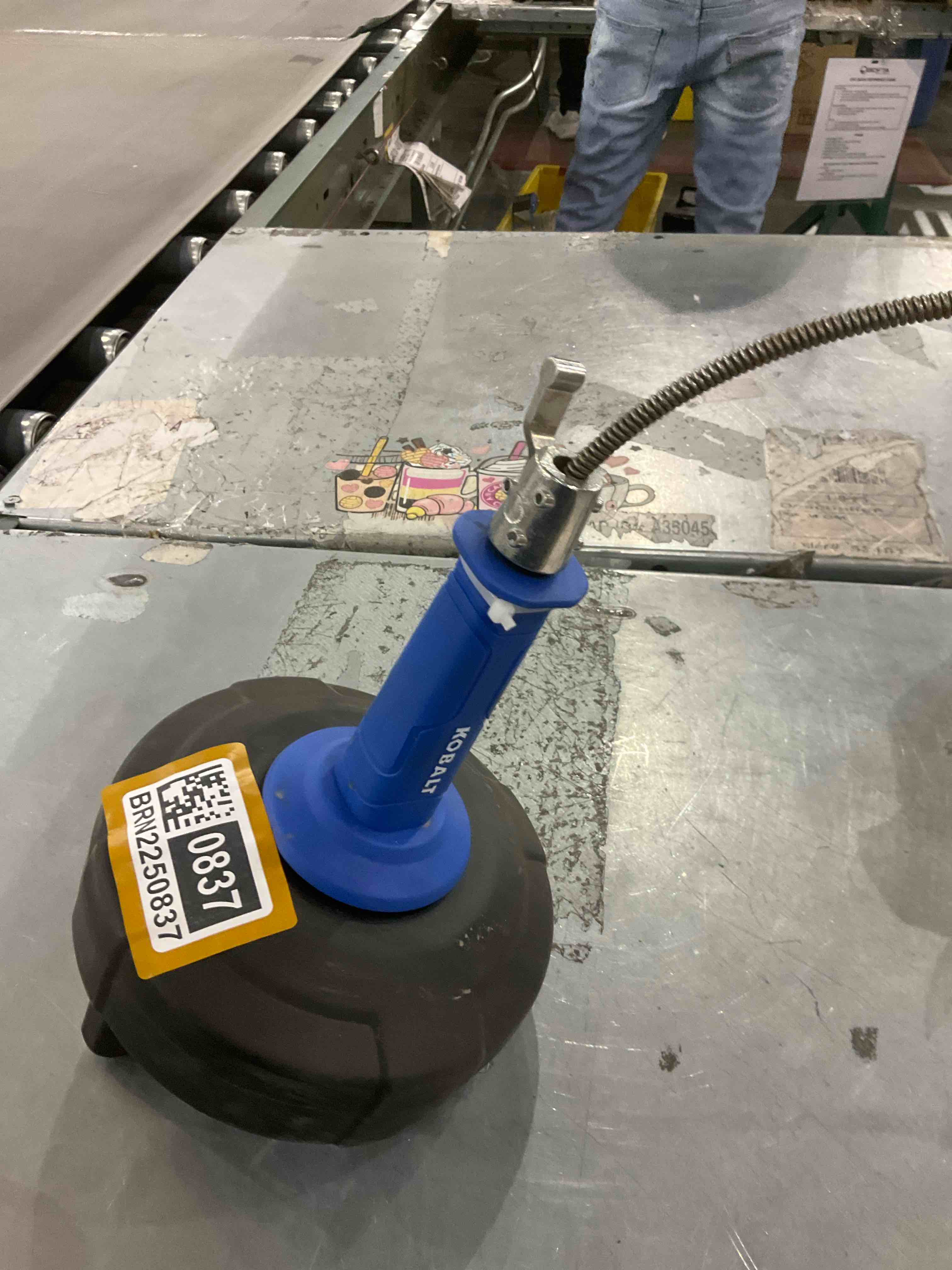 Condition photo showing As Is for a tool used for clearing clogged drains.