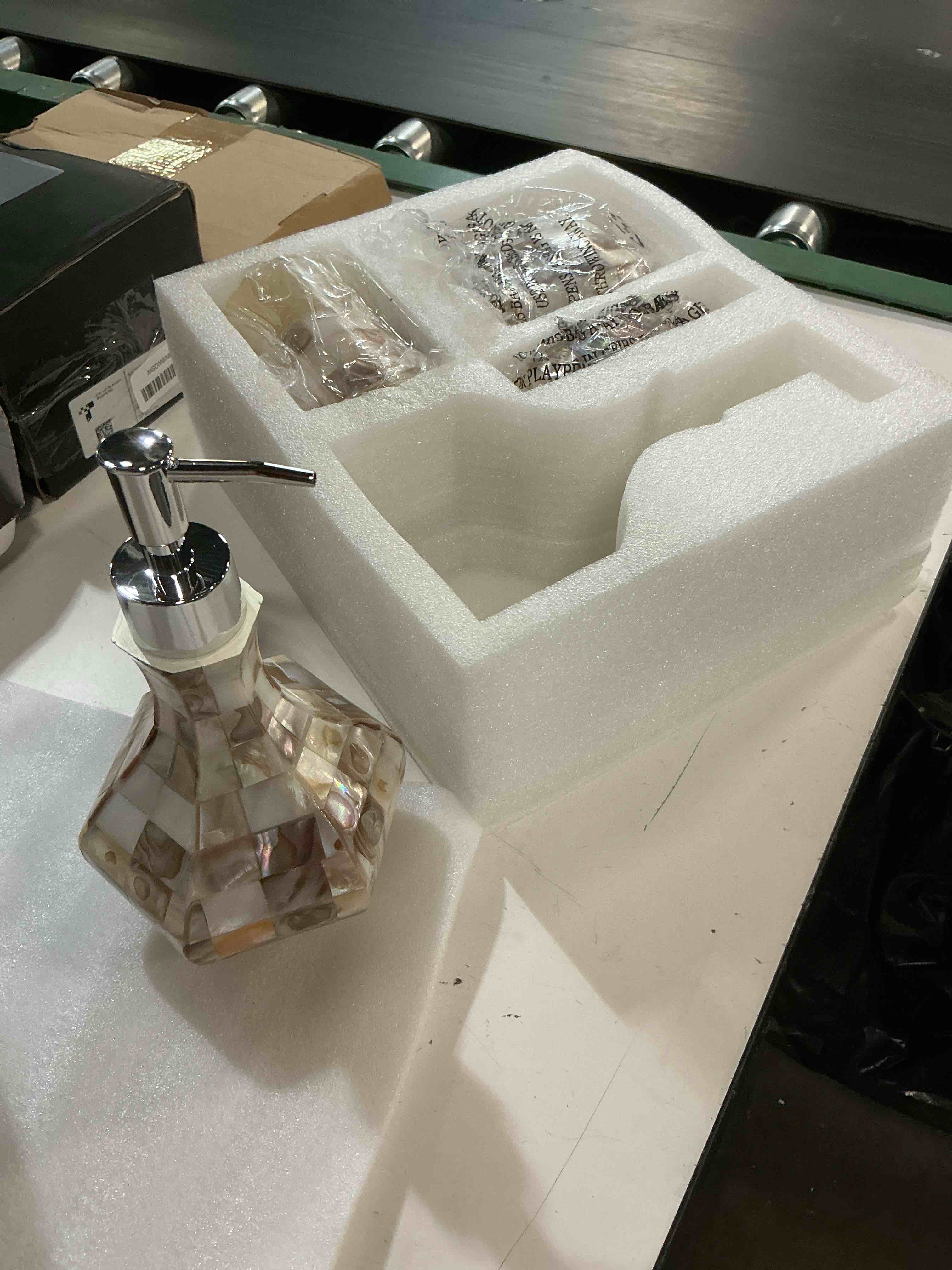Condition photo showing New/Like New for milano bathroom accessories set - 4 piece bathroom accessory set with natural mother of pearl shells - decorative bathroom set includes: soap dispenser, toothbrush holder, tumbler and soap dish 4 pc. bathroom accessory set