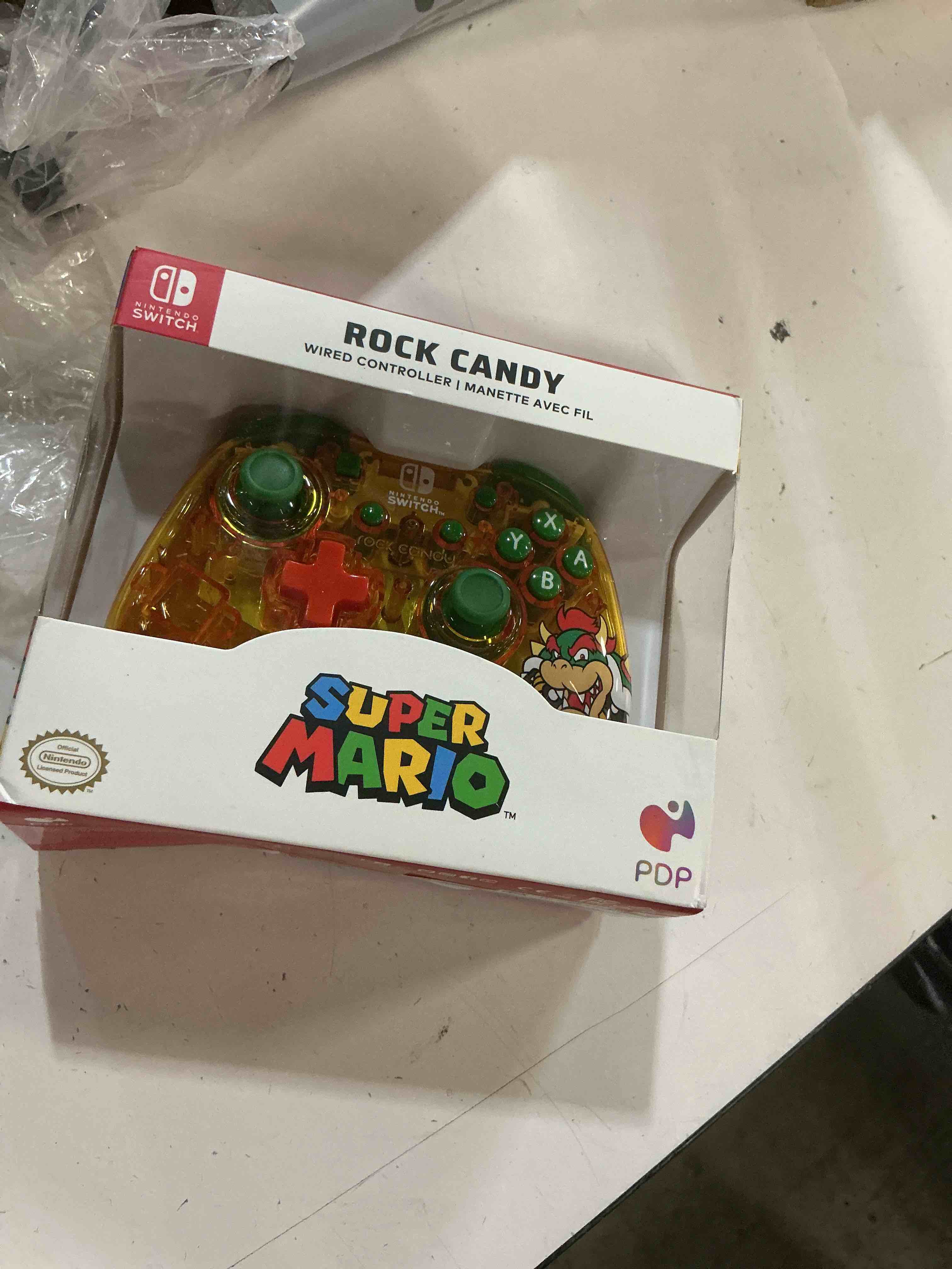 Condition photo showing New/Like New for pdp gaming rock candy wired power nintendo switch pro controller, officially licensed lite/oled compatible gamepad, super mario brothers - lemon bomb bowser (orange/green)