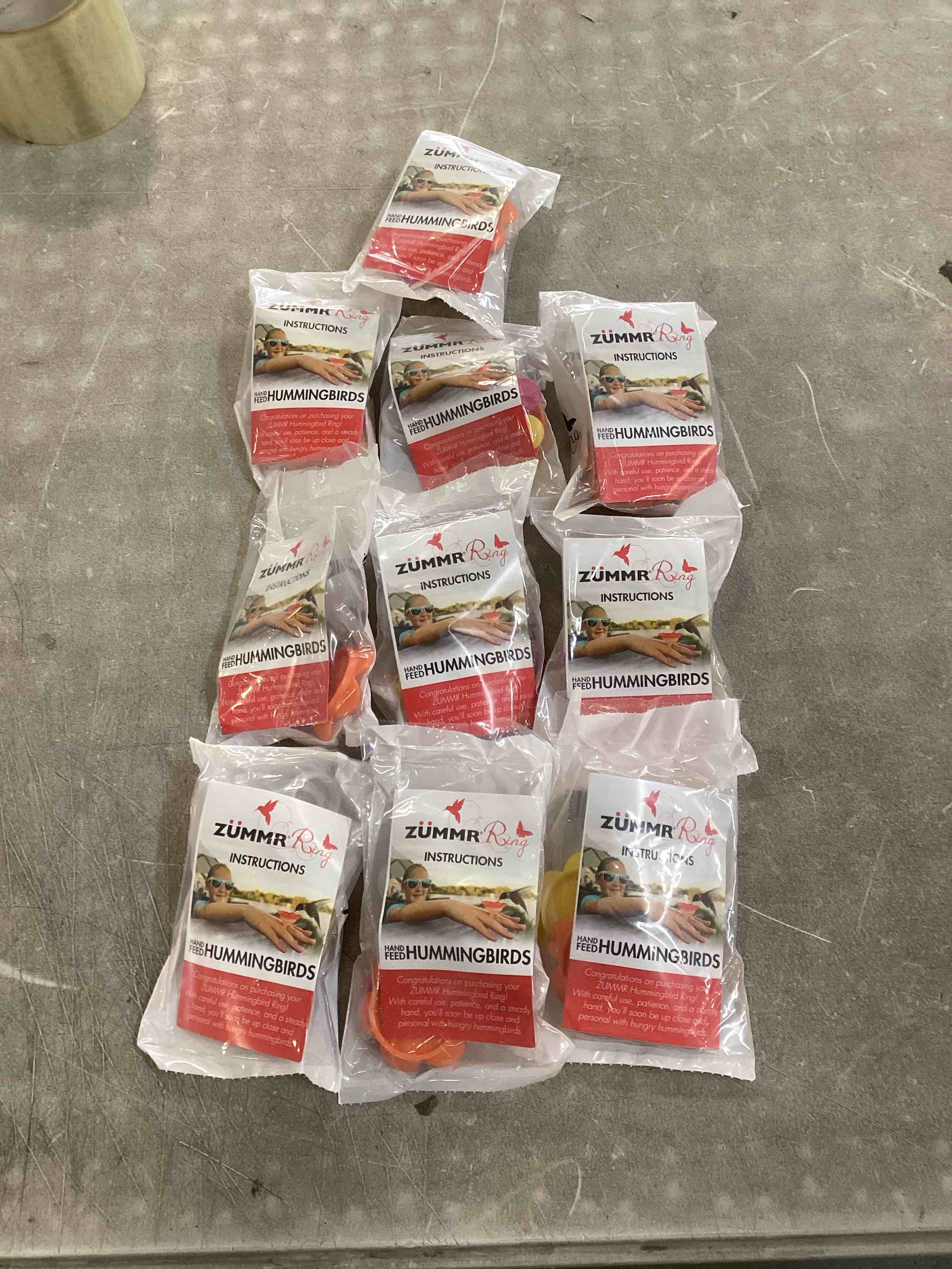 Condition photo showing New/Like New for (3-Pack) - ZUMMR Hummingbird Ring Feeder (Red  Green and Blue) 10 count