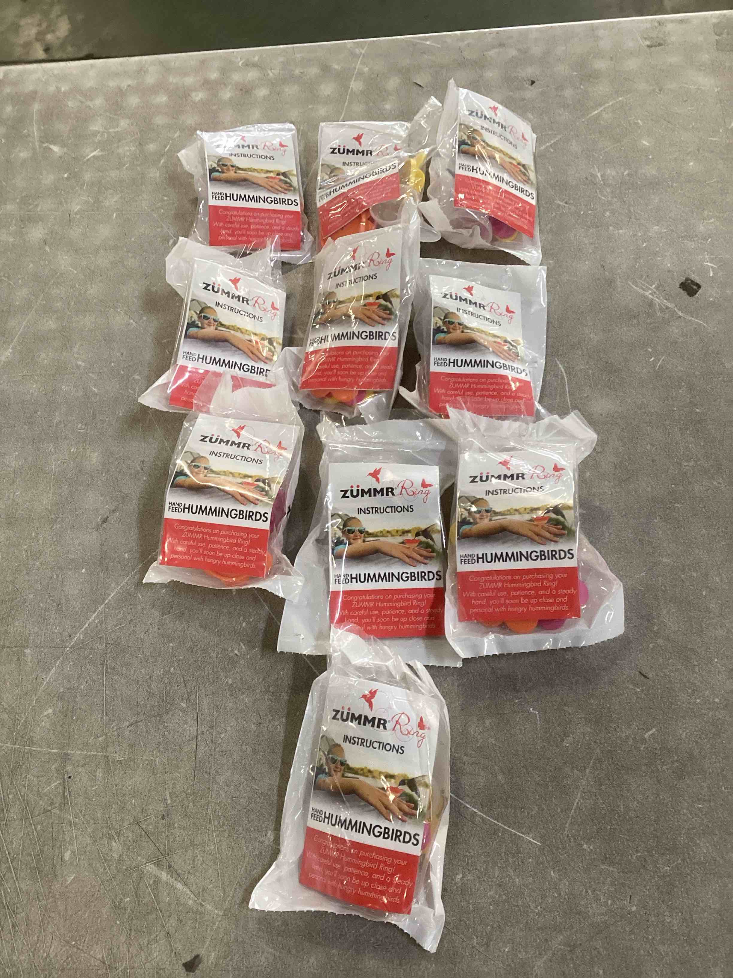 Condition photo showing New/Like New for (3-Pack) - ZUMMR Hummingbird Ring Feeder (Red Green and Blue) 10 count