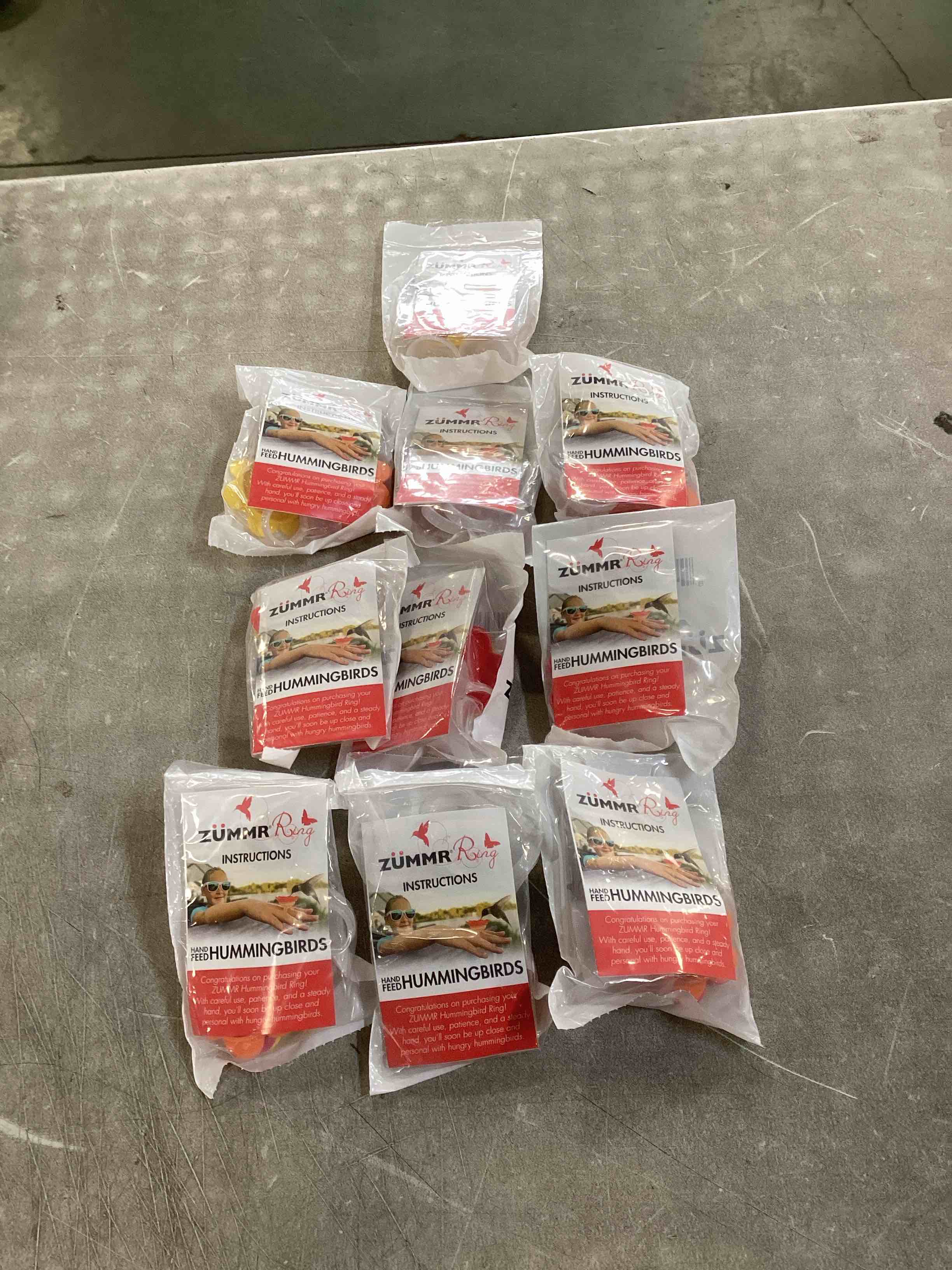 Condition photo showing New/Like New for (3-Pack) - ZUMMR Hummingbird Ring Feeder (Red  Green and Blue) 10 count