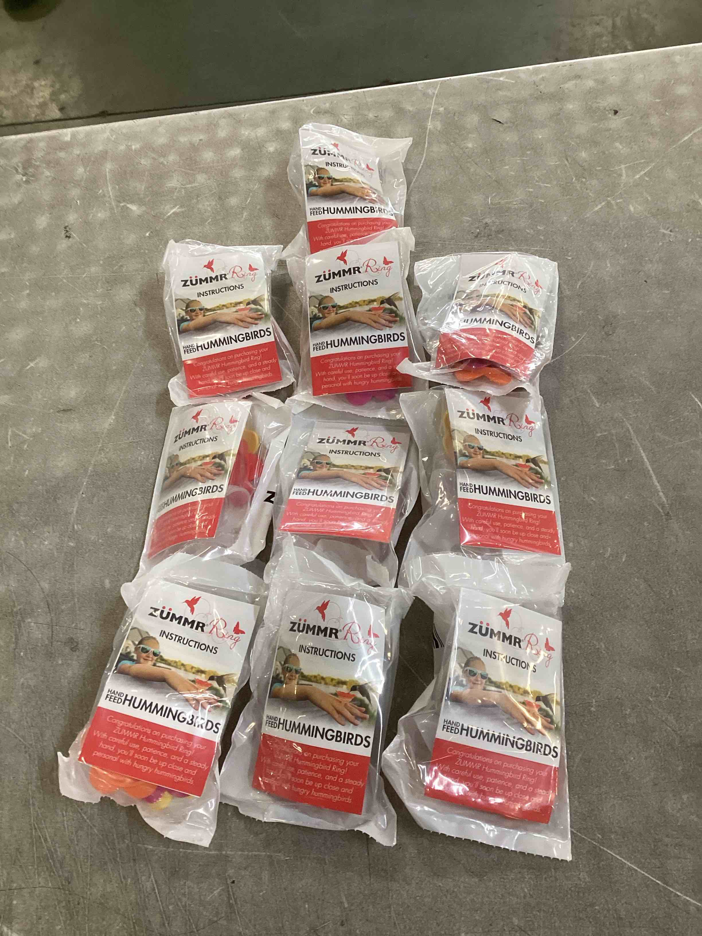 Condition photo showing New/Like New for (3-Pack) - ZUMMR Hummingbird Ring Feeder (Red  Green and Blue) 10 count