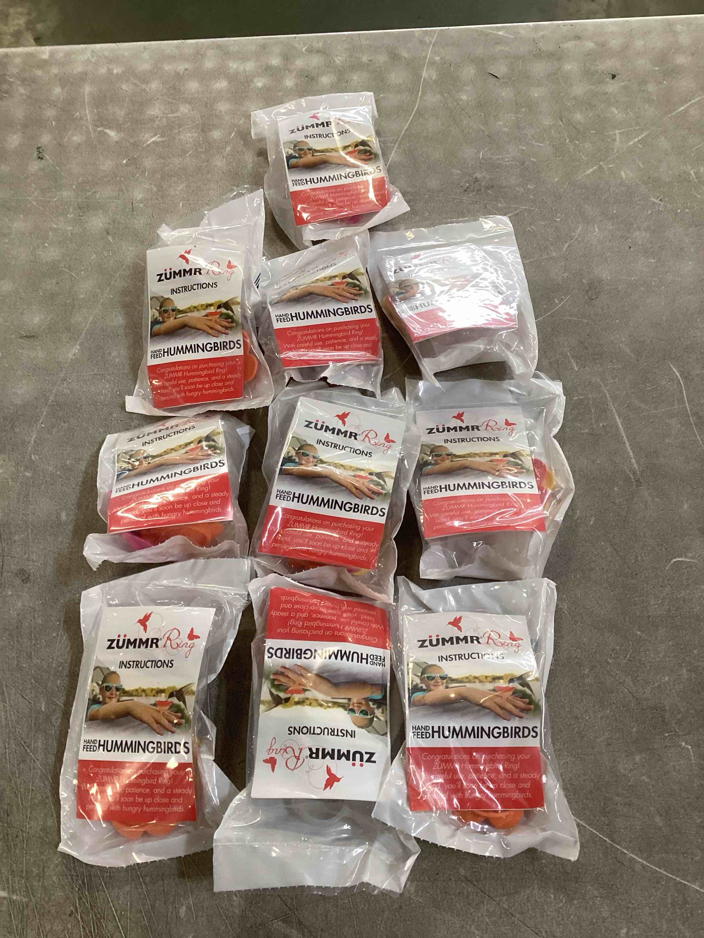 Condition photo showing New/Like New for (3-Pack) - ZUMMR Hummingbird Ring Feeder (Red  Green and Blue) 10 count