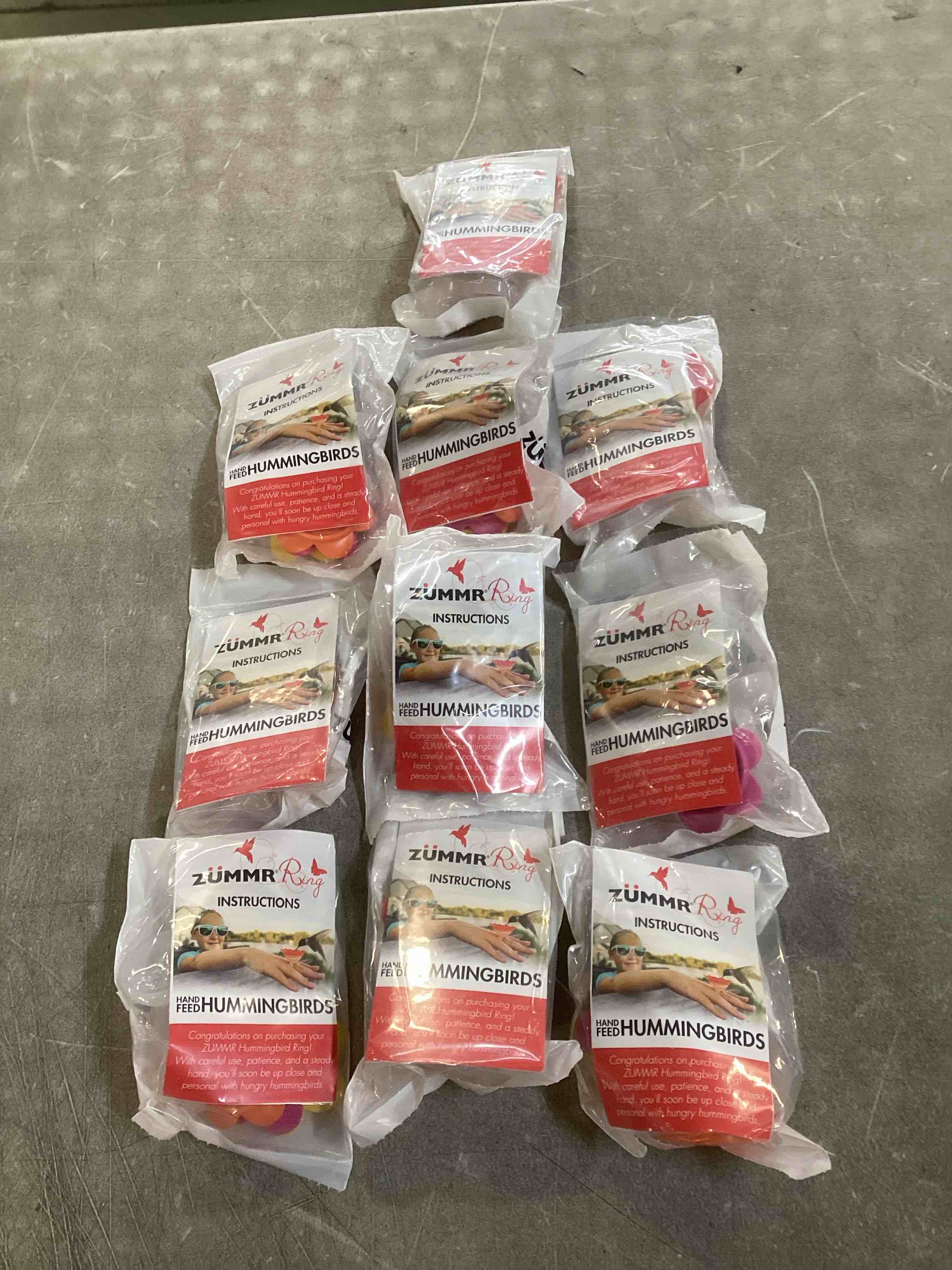 Condition photo showing New/Like New for (3-Pack) - ZUMMR Hummingbird Ring Feeder (Red  Green and Blue) 10 count