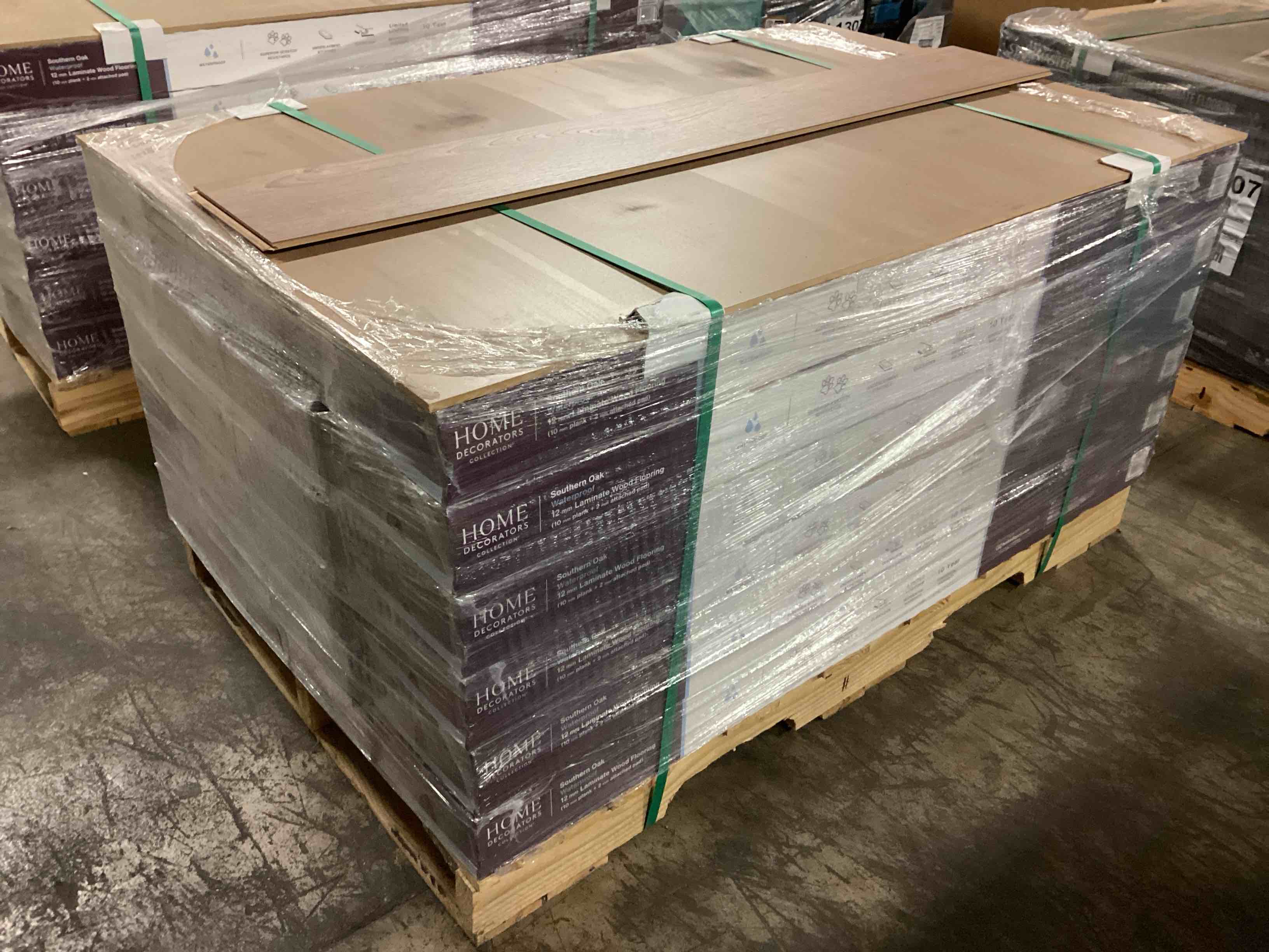 505.35 sq.ft. of 12mm (10mm plank + 2mm attached pad) laminate flooring, your bid per sq.ft