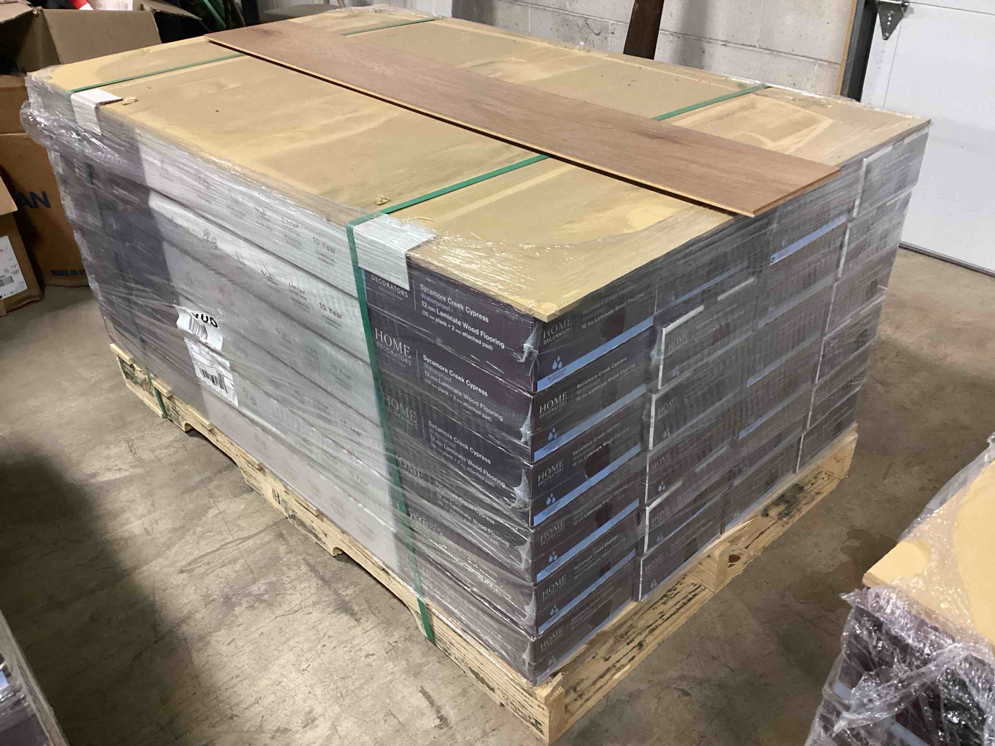 505.35 sq.ft. of 12mm (10mm plank + 2mm attached pad) laminate flooring, your bid per sq.ft