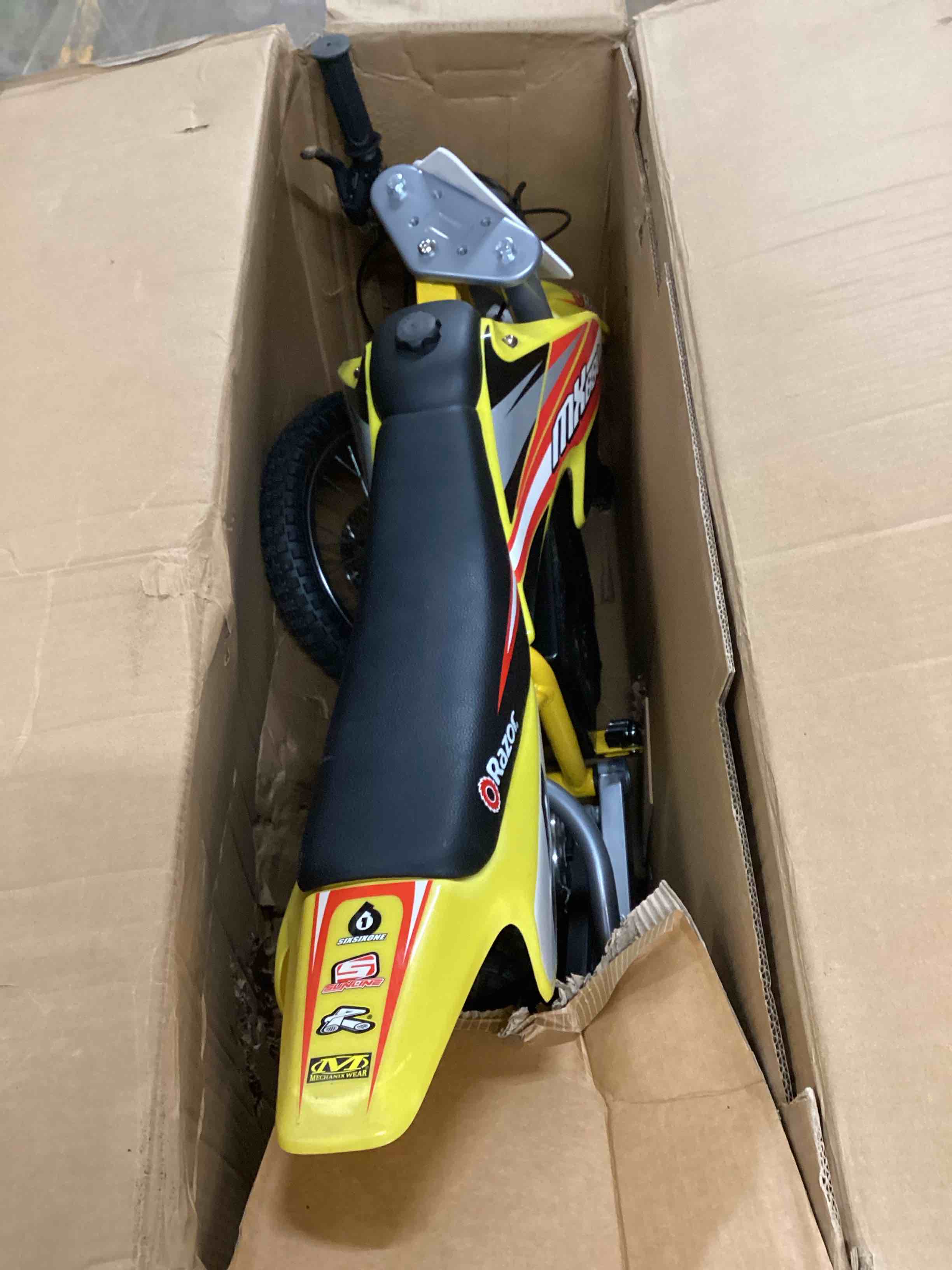 Condition photo showing As Is for Razor MX650 Dirt Rocket Electric Motocross Off-Road Bike - Yellow