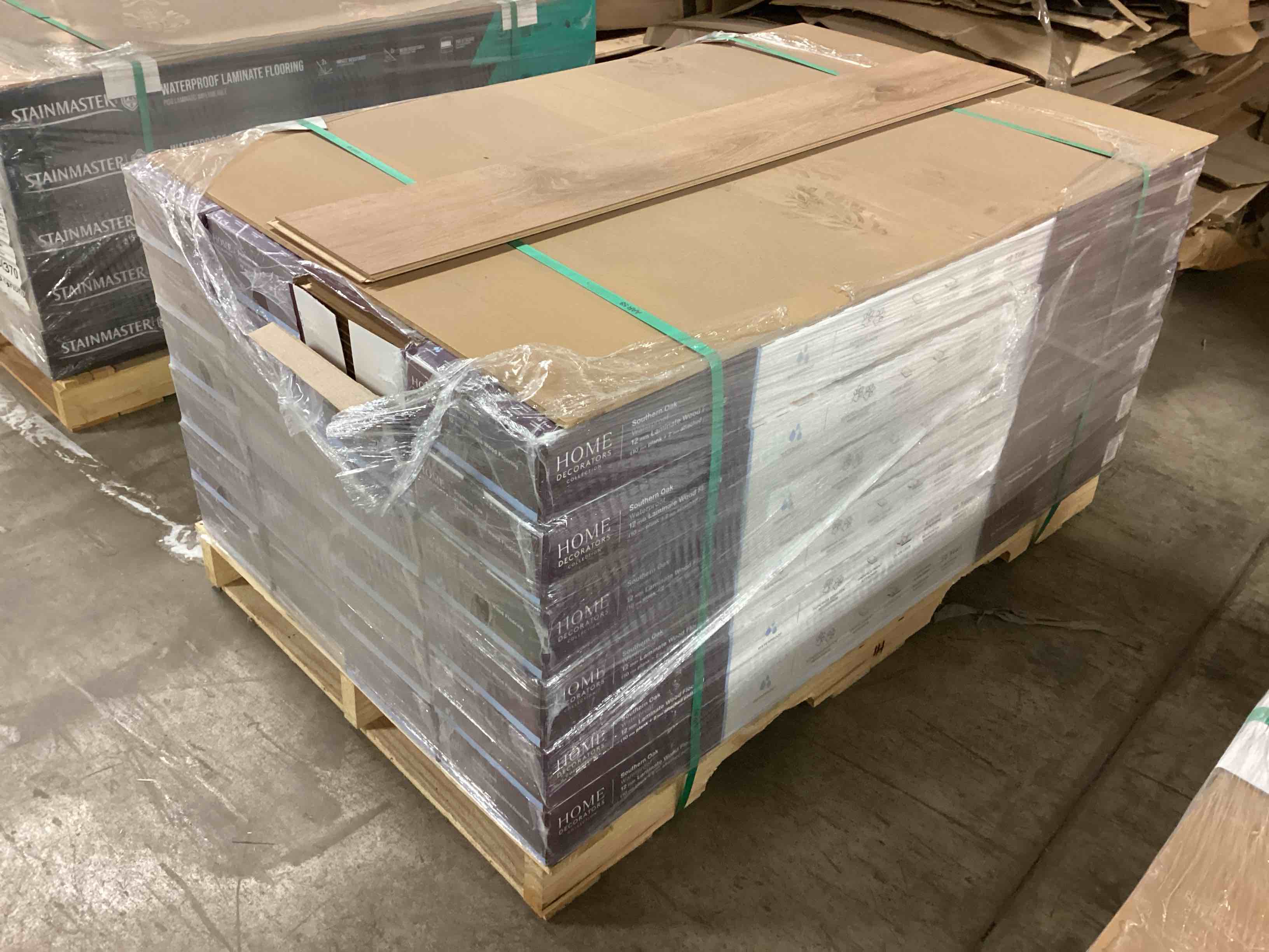 505.35 sq.ft. of 12mm (10mm plank + 2mm attached pad) laminate flooring, your bid per sq.ft