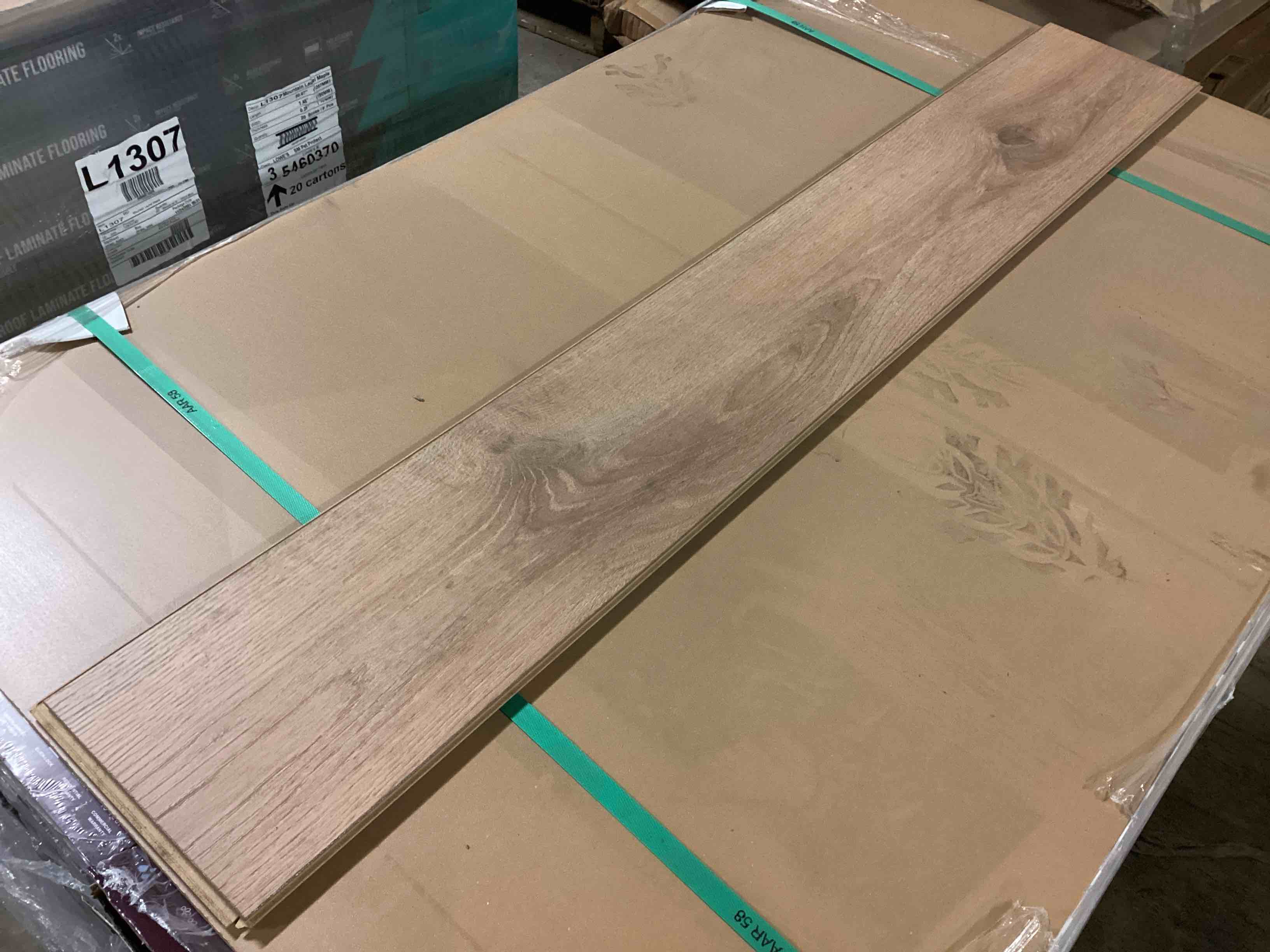 Condition photo showing New/Like New for 505.35 sq.ft. of 12mm (10mm plank + 2mm attached pad) laminate flooring, your bid per sq.ft