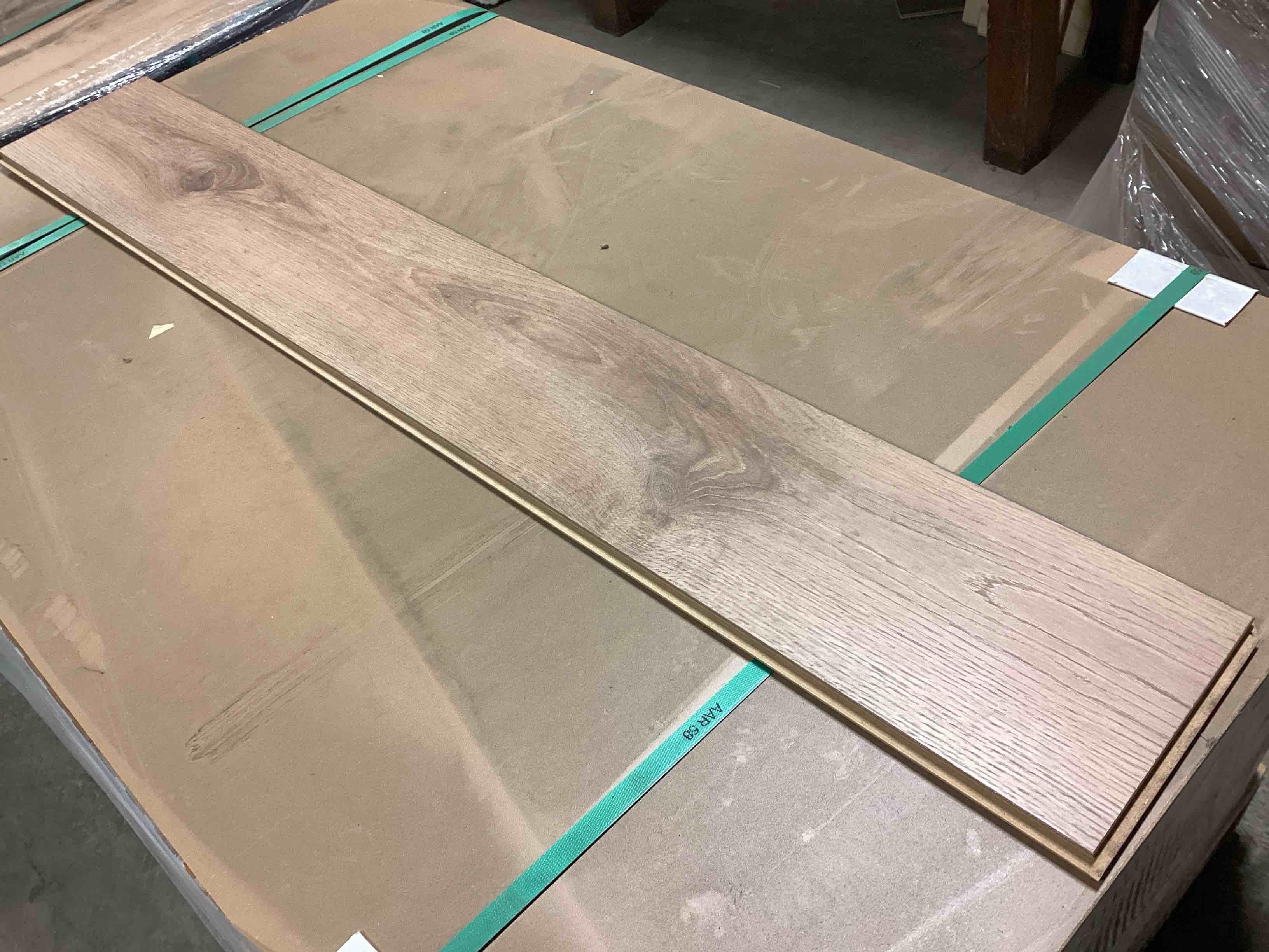 Condition photo showing New/Like New for 505.35 Sq.Ft. Of 12mm (10mm Plank + 2mm Attached Pad) Laminate Flooring, Your Bid Per Sq.Ft
