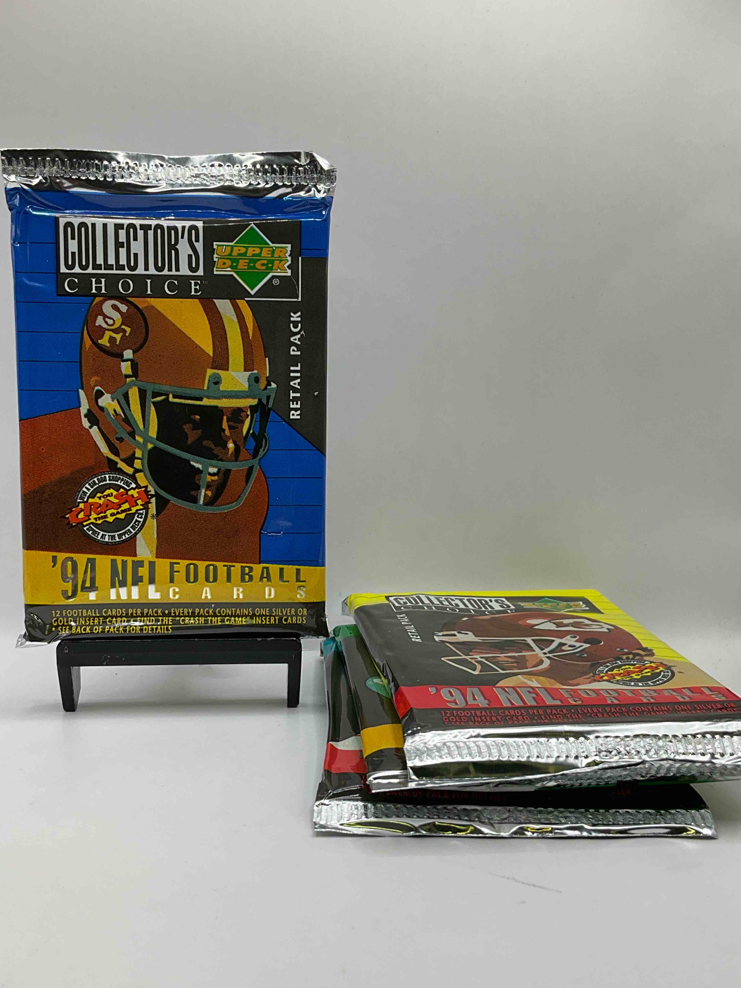 1994 Collectors Choice! Gold & Silver Card In Every Pack! Upper Deck Football Card Packs! 12 Card Football Packs, Search For The “Crash the Game” Insert Cards! Search For Big NFL Names Like Barry Sanders, Jerry Rice, Joe Montana, John Elway, Dan Marino & More! Wow!