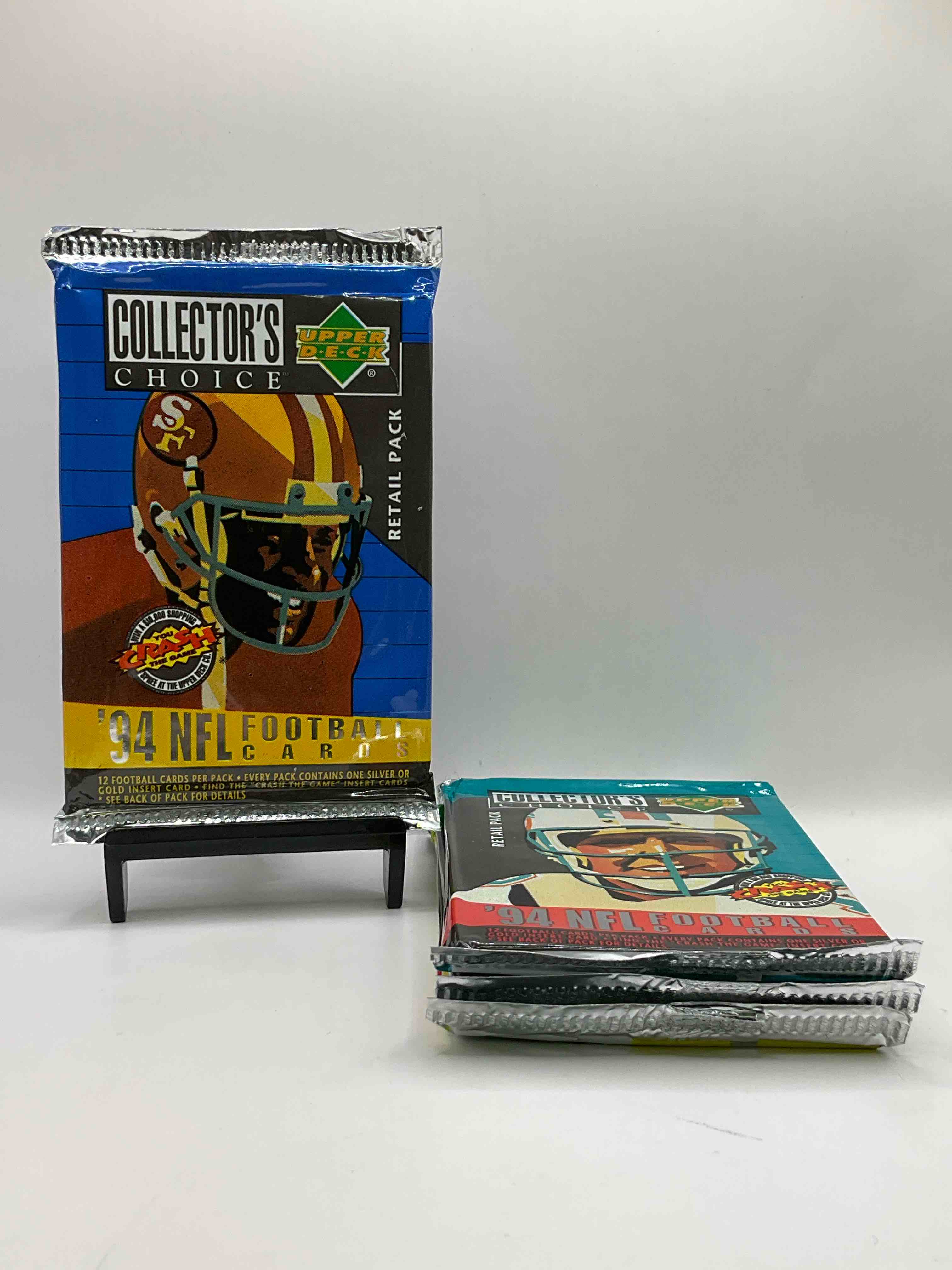 1994 Collectors Choice! Gold & Silver Card In Every Pack! Upper Deck Football Card Packs! 12 Card Football Packs, Search For The “Crash the Game” Insert Cards! Search For Big NFL Names Like Barry Sanders, Jerry Rice, Joe Montana, John Elway, Dan Marino & More! Wow!