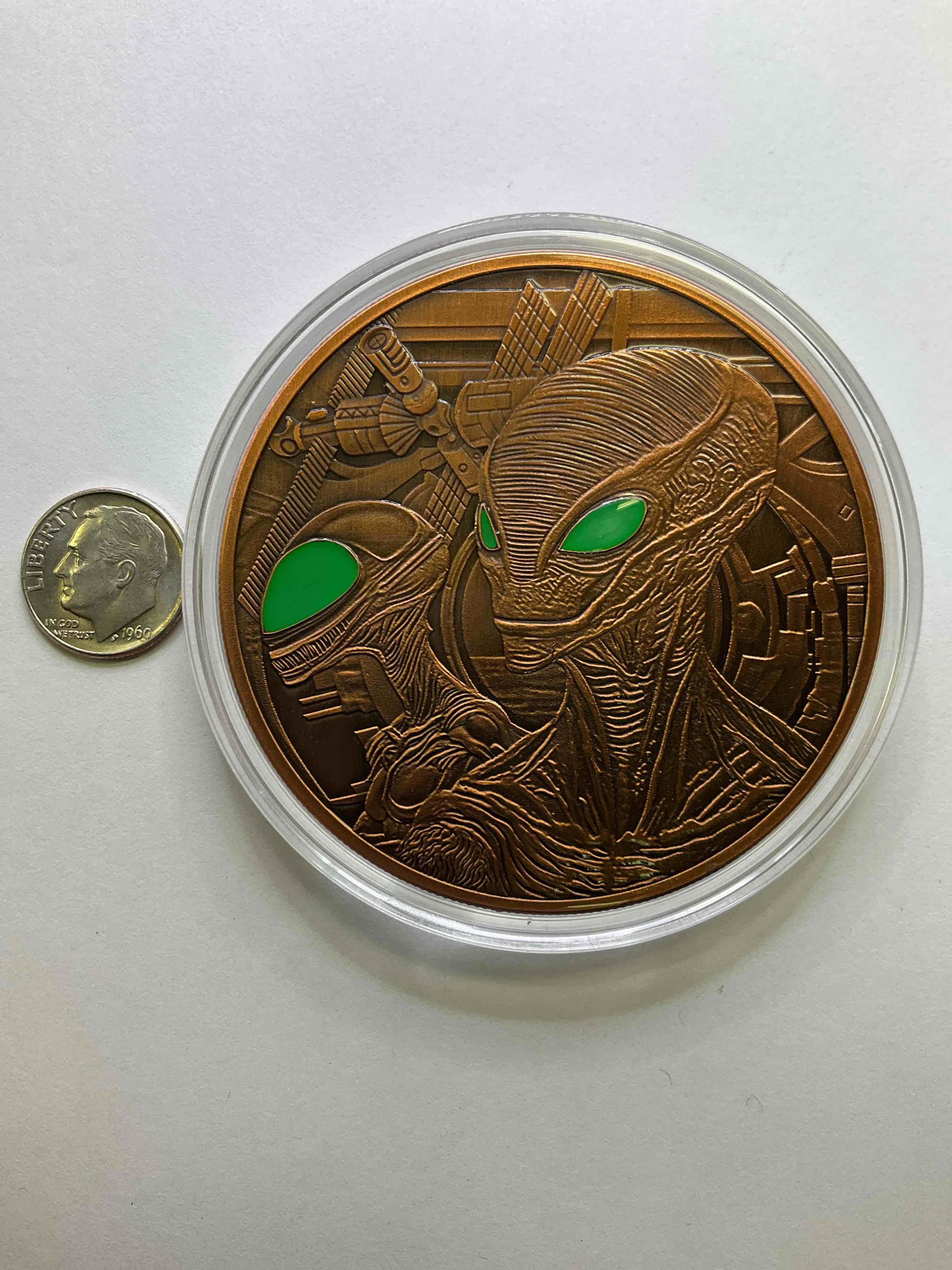 Huge Pure Copper Alien Wow! Giant 5 oz Pure Fine U.S. Copper Collector Coin! Almost 3" Diameter! Check Out This Massive 5 OZ Pure Copper Coin, With The Image Of Aliens With Colored Eyes! Makes For A Great Gift & Cool Investment In Copper. Copper Value Continues To Rise & Copper Also Has Amazing Health Benefits. Rare To See Pure Copper In Such A Large Size! U.S. Dime Shown In Image Is For Size Reference Only (not included). Comes In Clear Holding Case. Invest In Fine U.S. Copper!