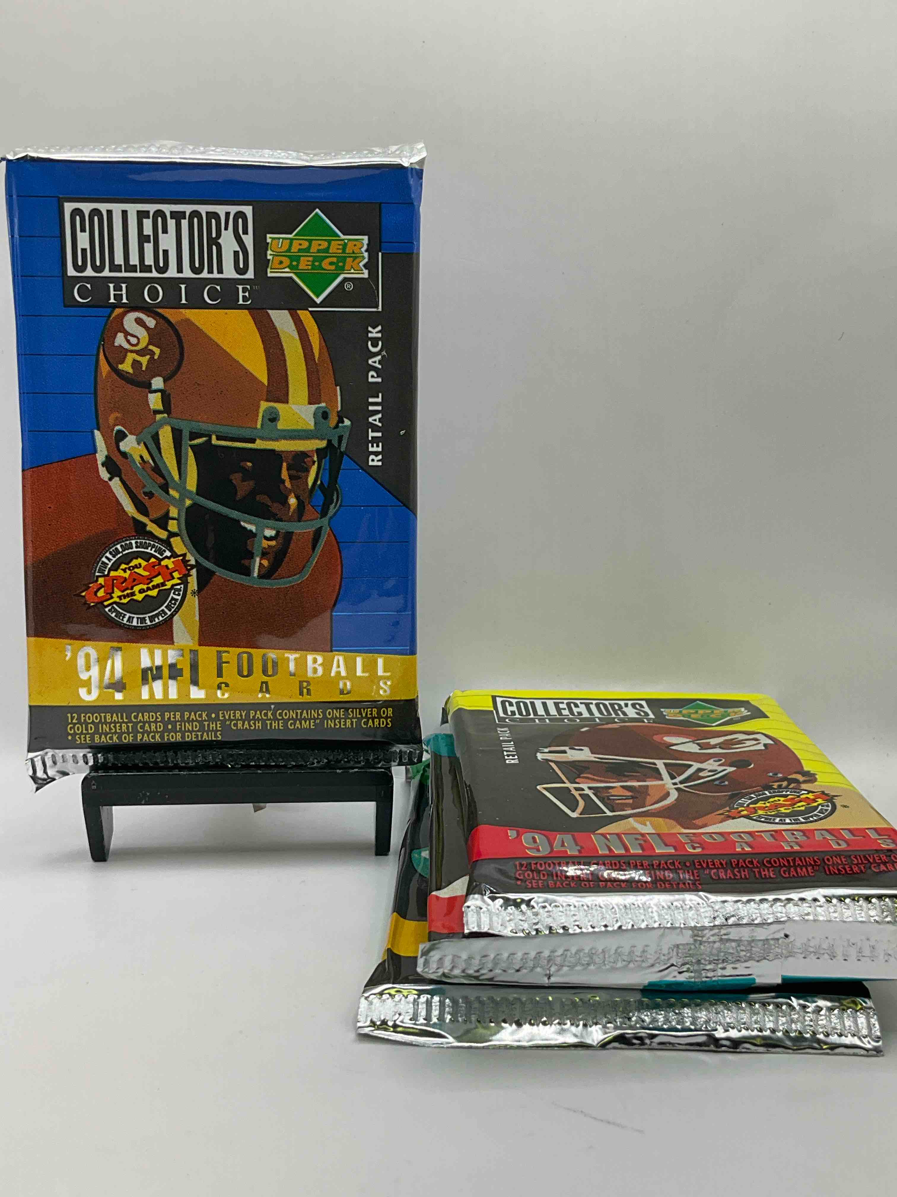 1994 Collectors Choice! Gold & Silver Card In Every Pack! Upper Deck Football Card Packs! 12 Card Football Packs, Search For The “Crash the Game” Insert Cards! Search For Big NFL Names Like Barry Sanders, Jerry Rice, Joe Montana, John Elway, Dan Marino & More! Wow!