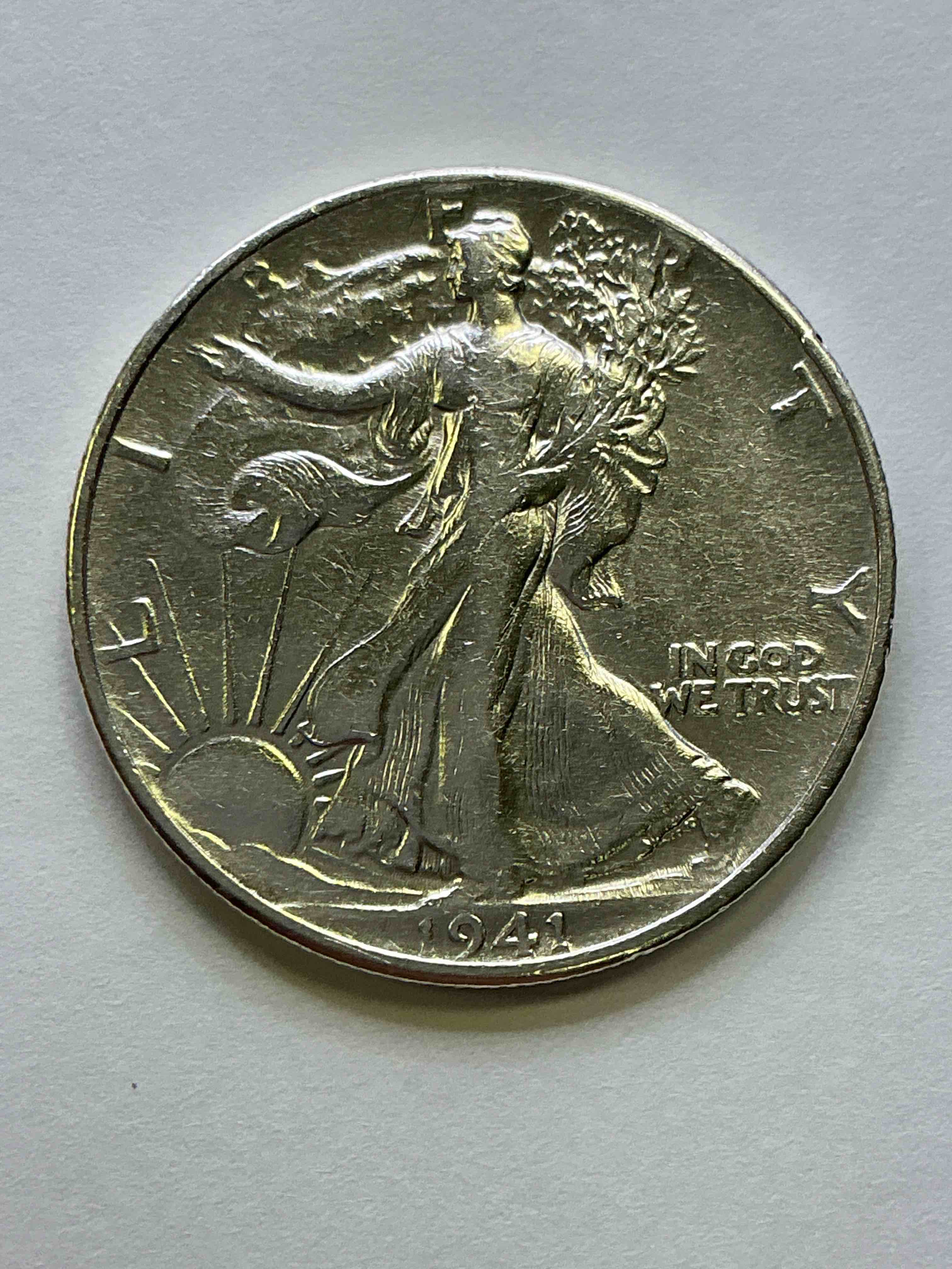 World War II Silver! Antique U.S. Silver! Liberty Walking Silver Fine U.S. Silver Half Dollar! This Striking Half Dollars Were Minted From 1916-1947 & Have Become Some Of The Most Collectible Coins In History! Here Is A Striking Circulated Example From 1941! Appears Uncirculated! Liberty Walking Coins Are 90% Fine U.S. Silver, A Great Investment In Precious Metal!