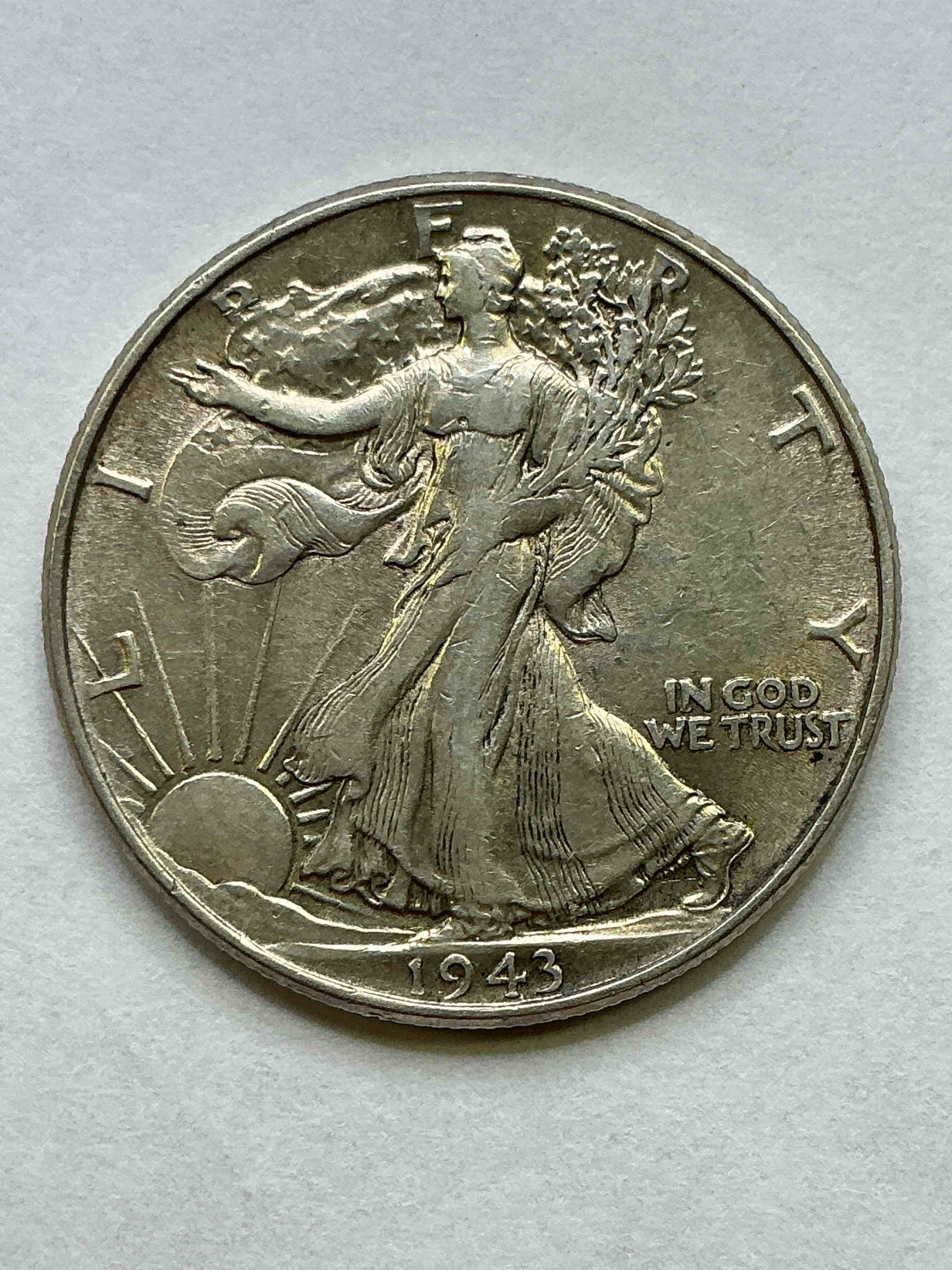 world war ii silver! antique u.s. silver! liberty walking silver fine u.s. silver half dollar! this striking half dollars were minted from 1916-1947 & have become some of the most collectible coins in history! here is a striking circulated example from 1943! appears uncirculated! liberty walking coins are 90% fine u.s. silver, a great investment in precious metal!