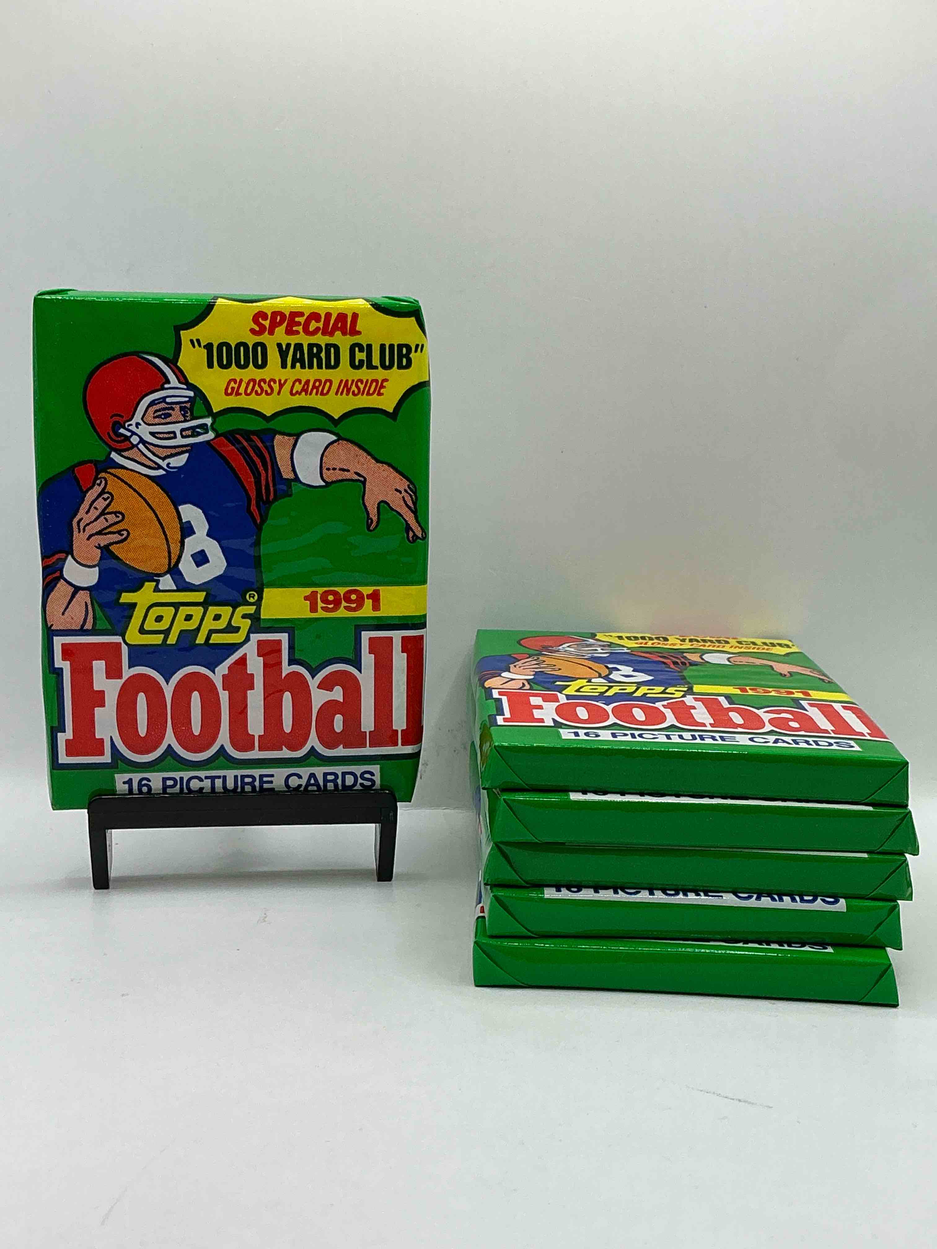 1991 topps football unopened sports card wax pack, direct from original retail case. search for early barry sanders, emmitt smith, jerry rice & joe montana!