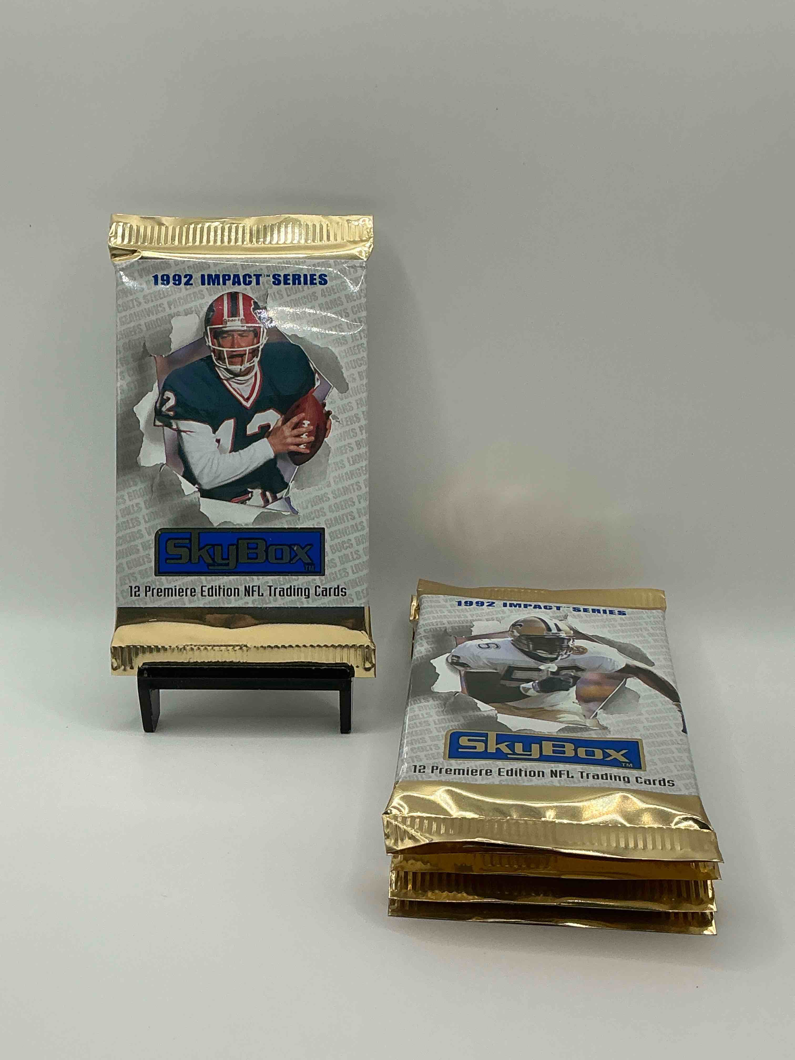 football insanity! 1992 skybox impact series premiere edition football card packs!all unopened & straight from box! high end cards! search for nfl stars brett favre, jim kelly, warren moon, joe montana, barry sanders & so many more, direct from original box!