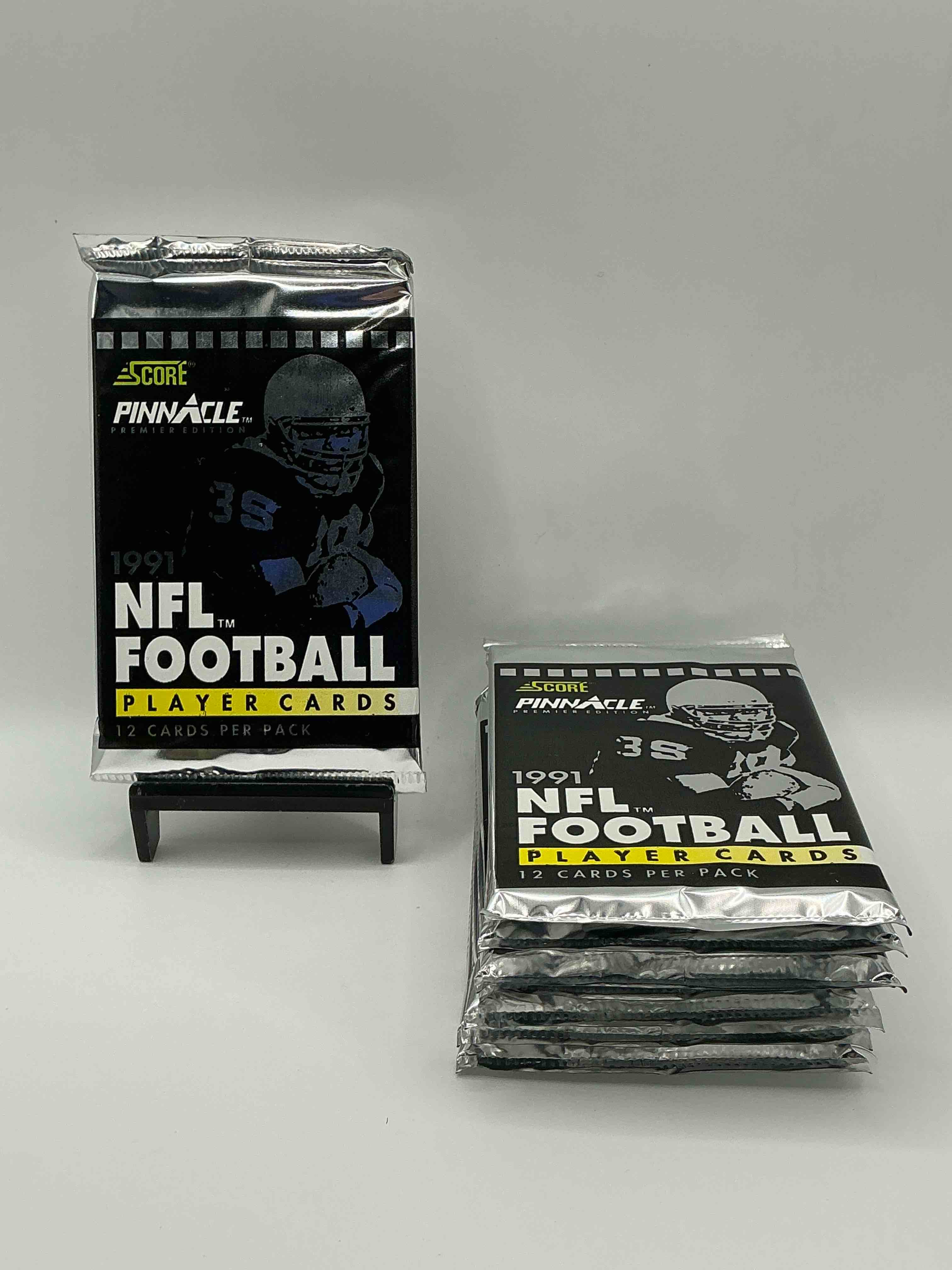 1991 NFL Score Pinnacle Football Sealed Card Pack, Direct From Original Retail Case! These Cards Are Sought After By Collectors For Their Awesome, Nostalgic Look. Search For Brett Favre Rookie, Early Jerry Rice, Early Emmit Smith, Joe Montana & So Much More!